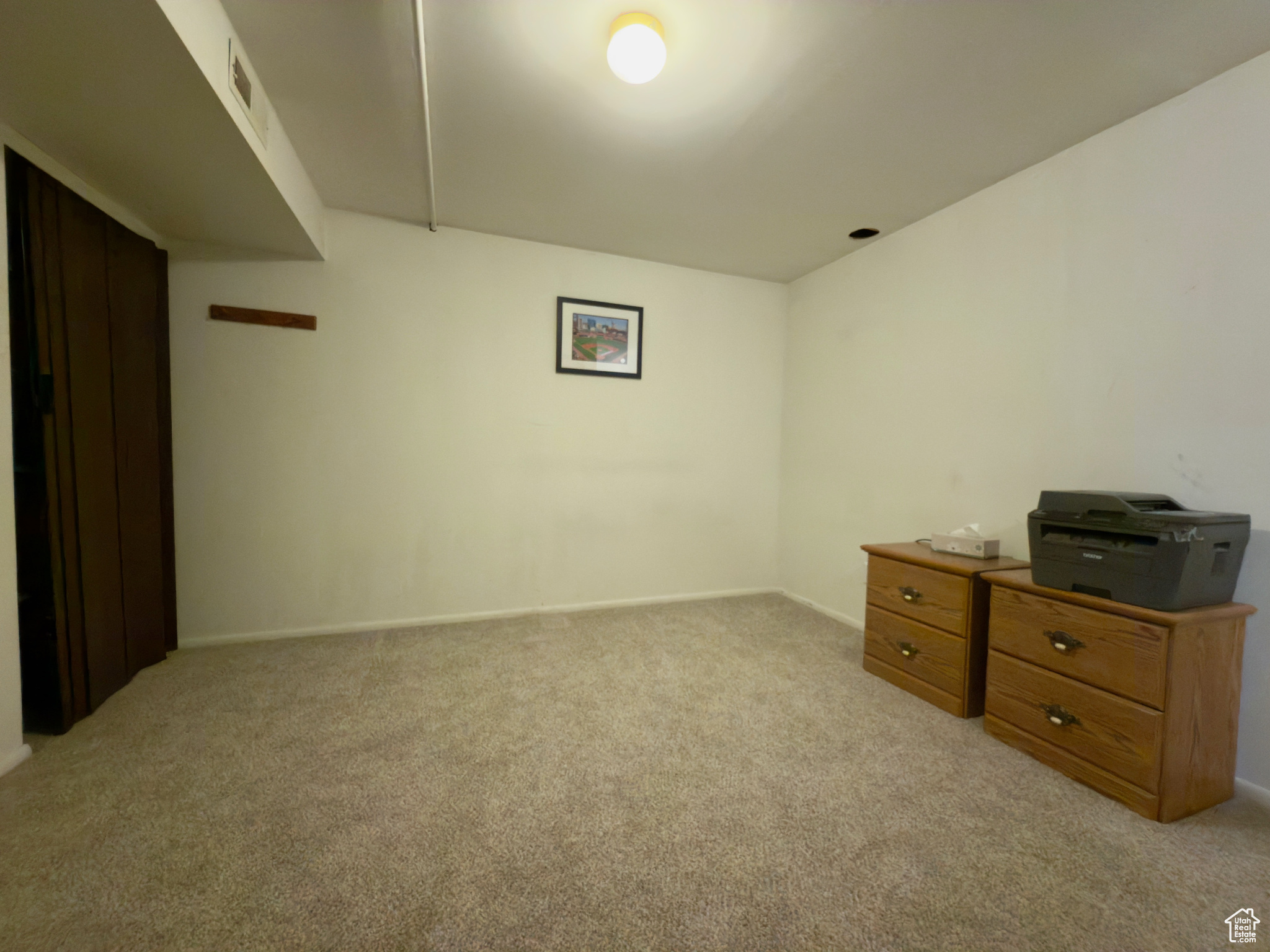 Basement bedroom with new carpet