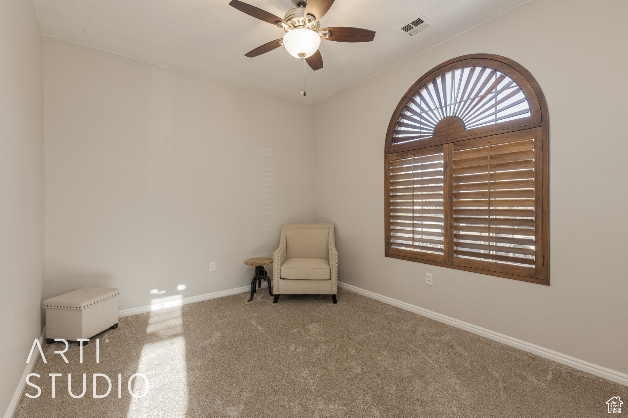 bedroom 3 with ceiling fan and carpet flooring