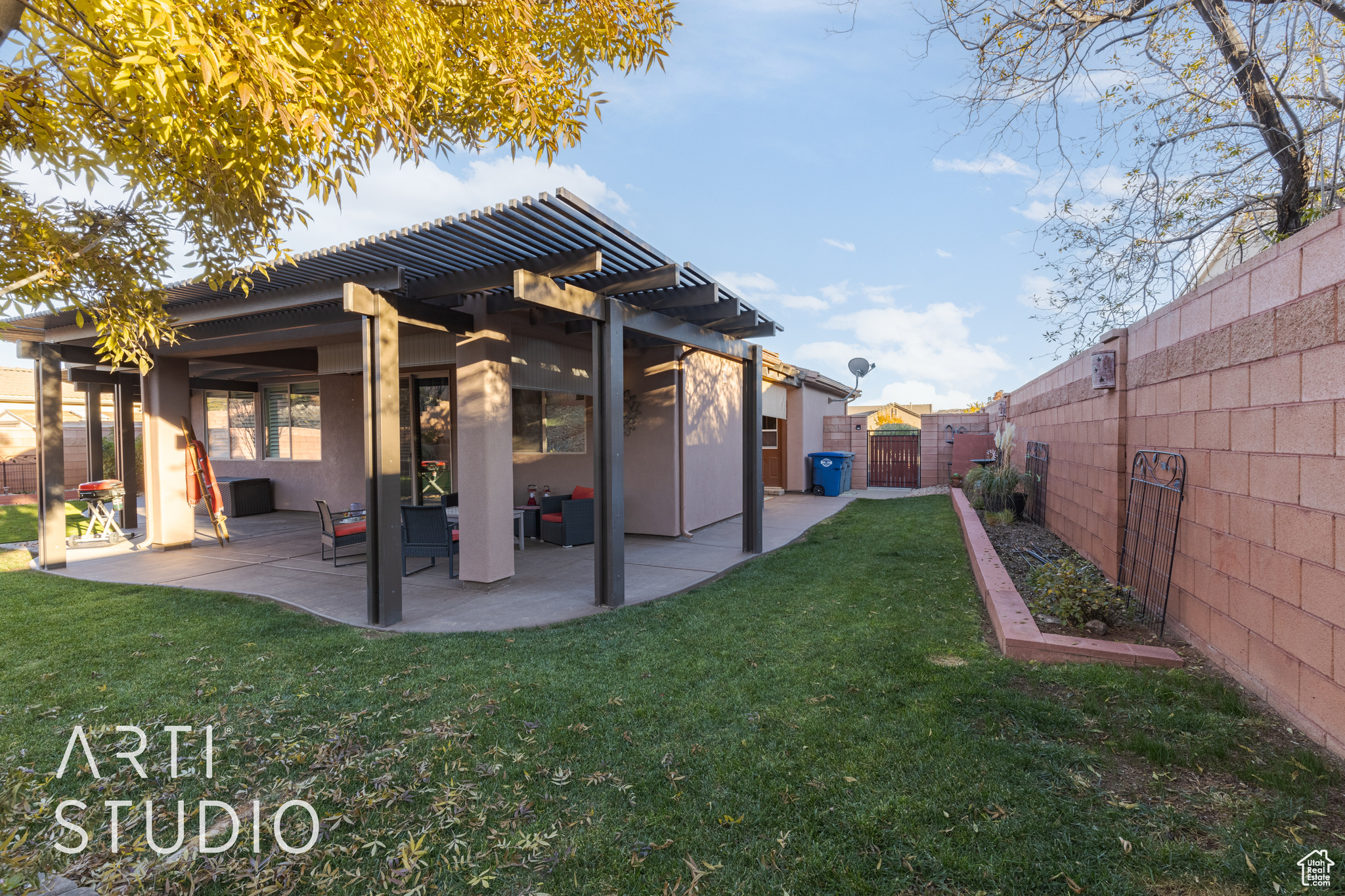 Back of house featuring a private yard, a patio, and a pergola