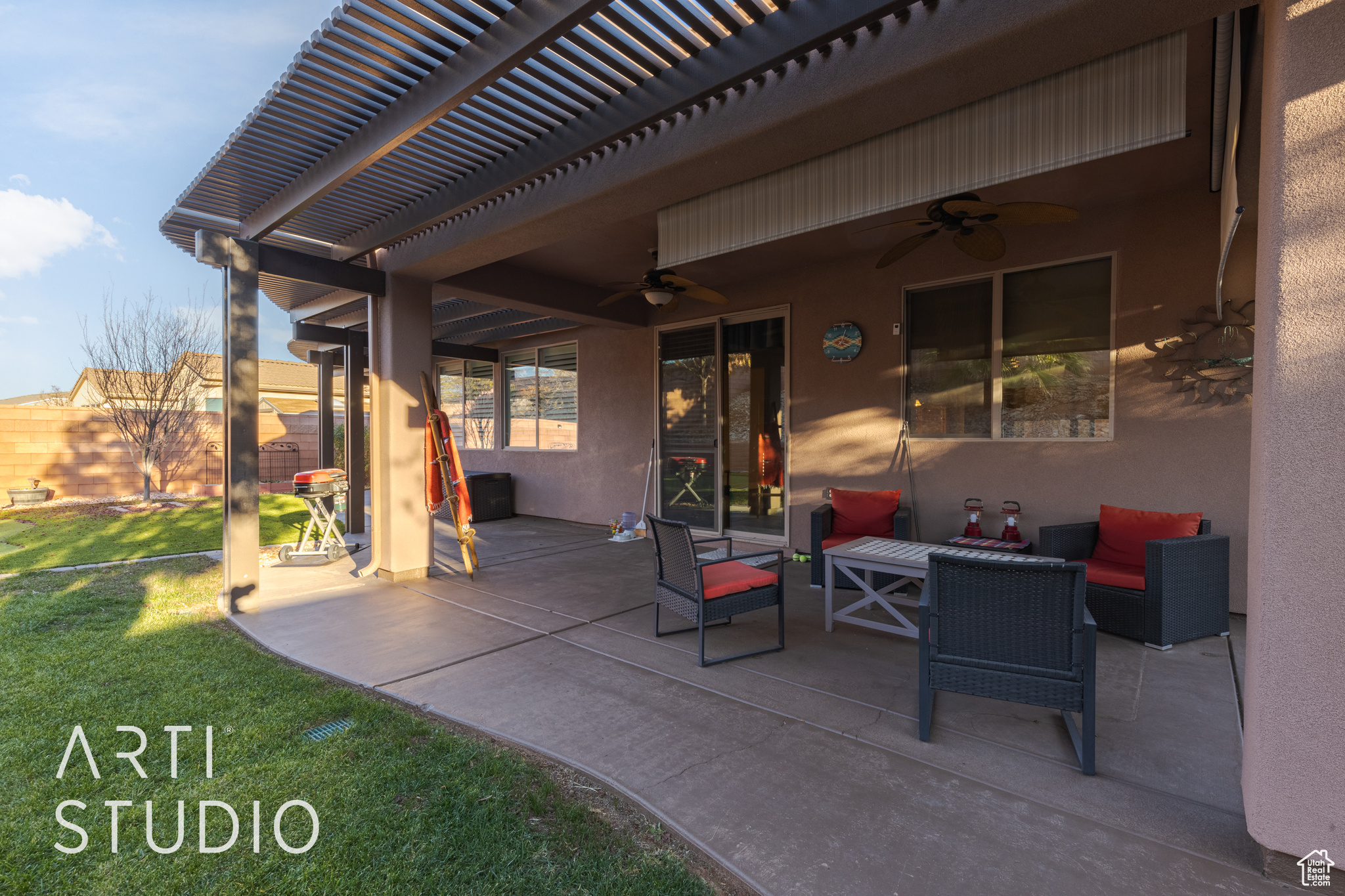 View of patio featuring outdoor lounge area, ceiling fan, and a pergola