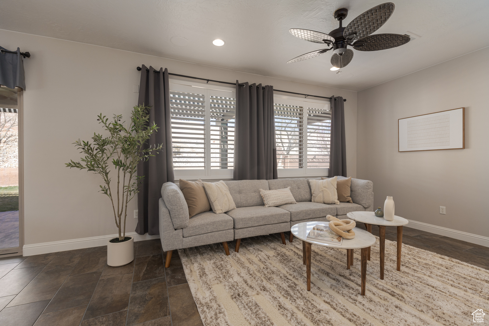 Living room featuring recessed lighting, and ceiling fan
