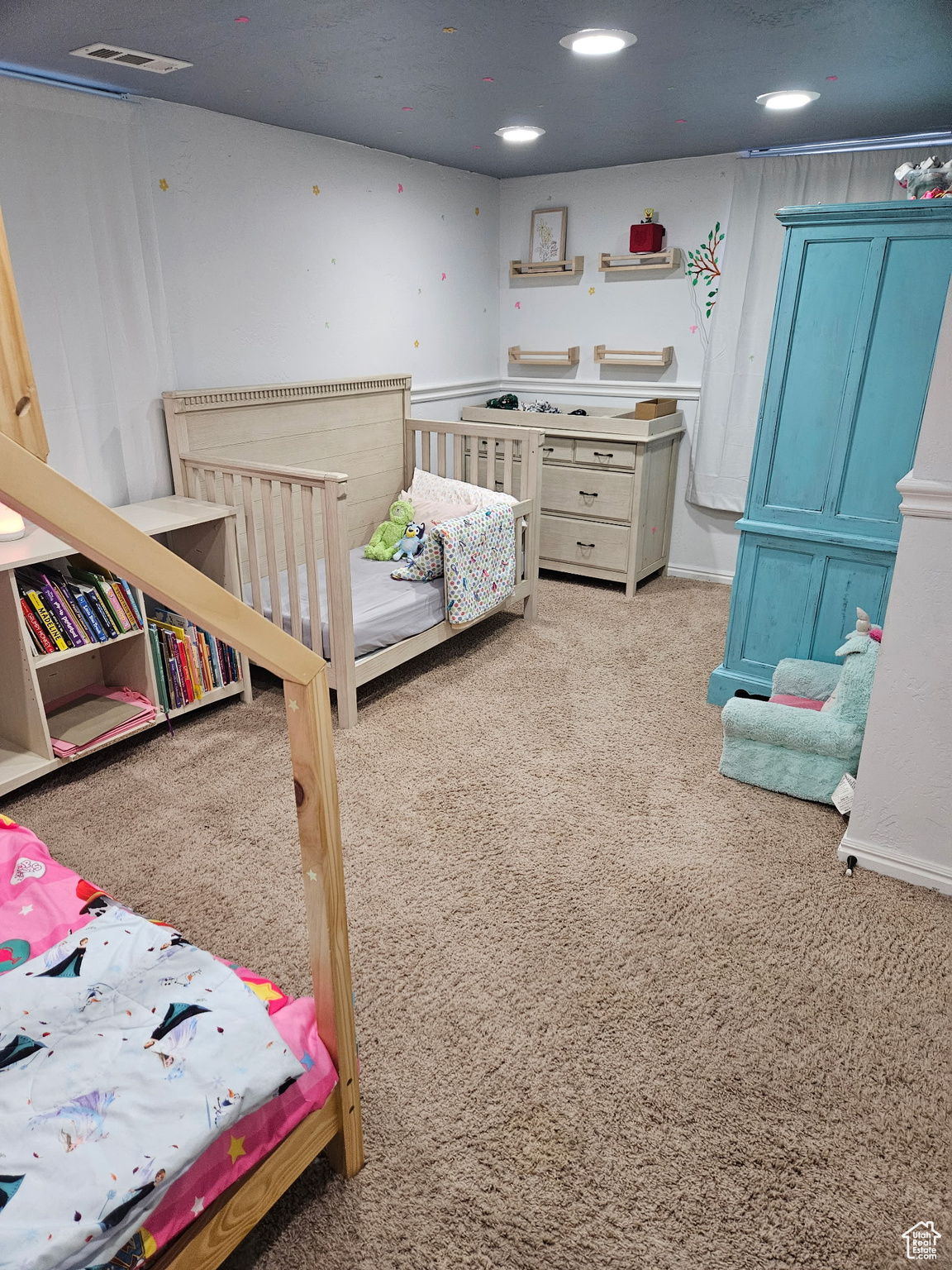 Carpeted bedroom featuring visible vents and recessed lighting
