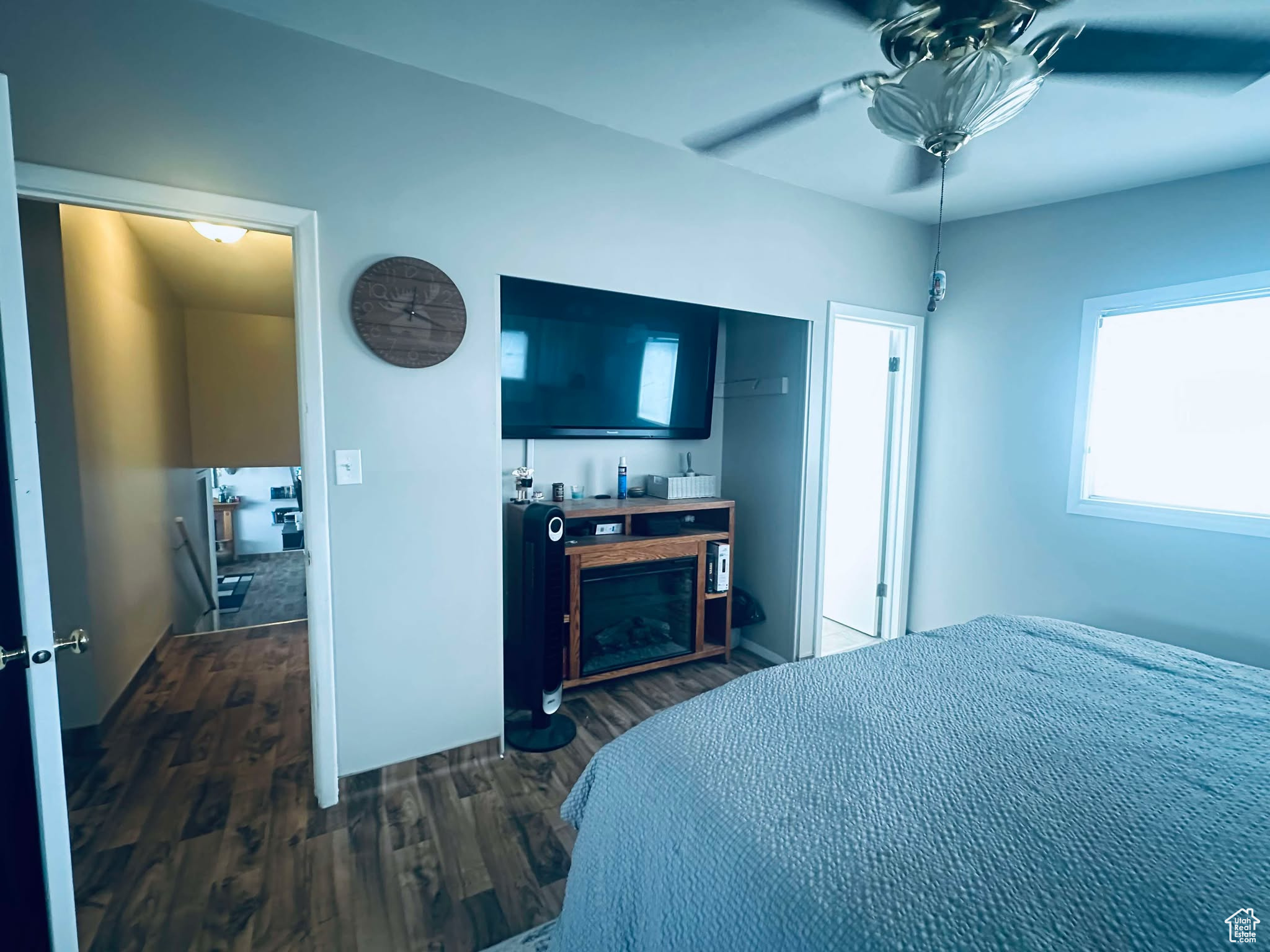 Master Bedroom with dark hardwood / wood-style flooring and ceiling fan