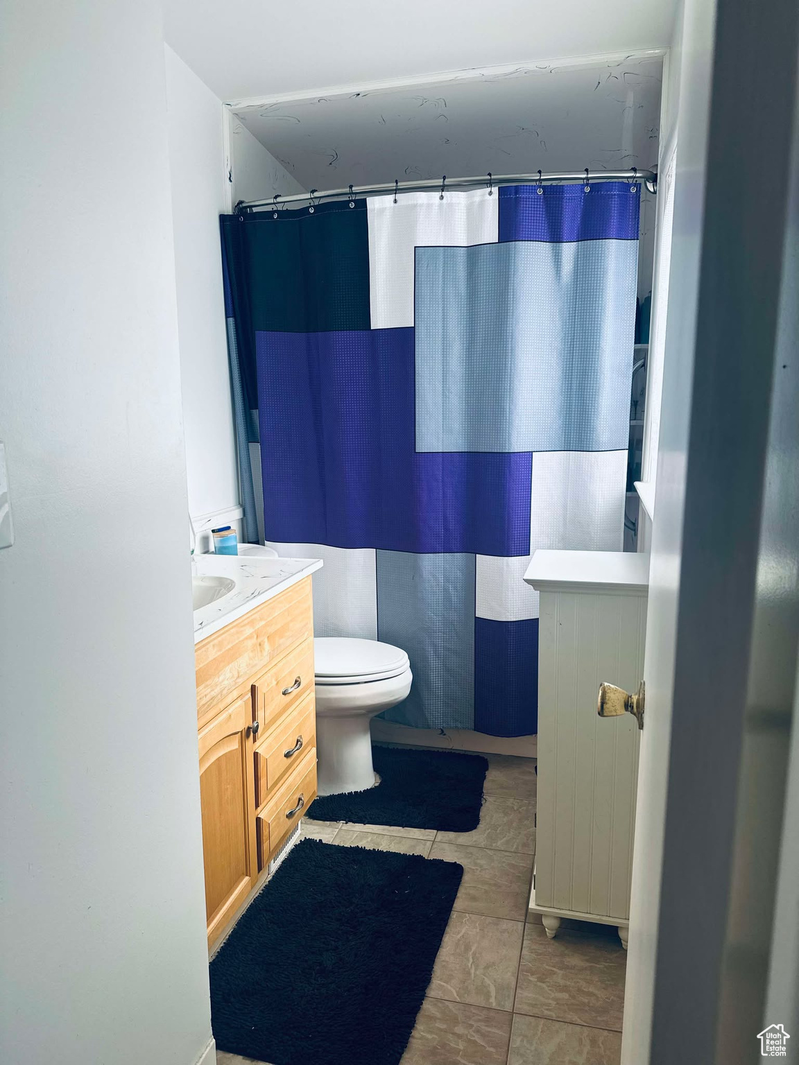 Master Bathroom with toilet and vanity