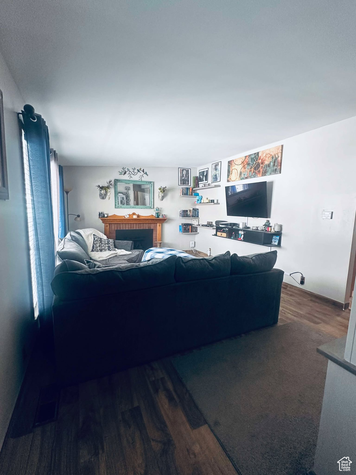 Living room with wood-type flooring