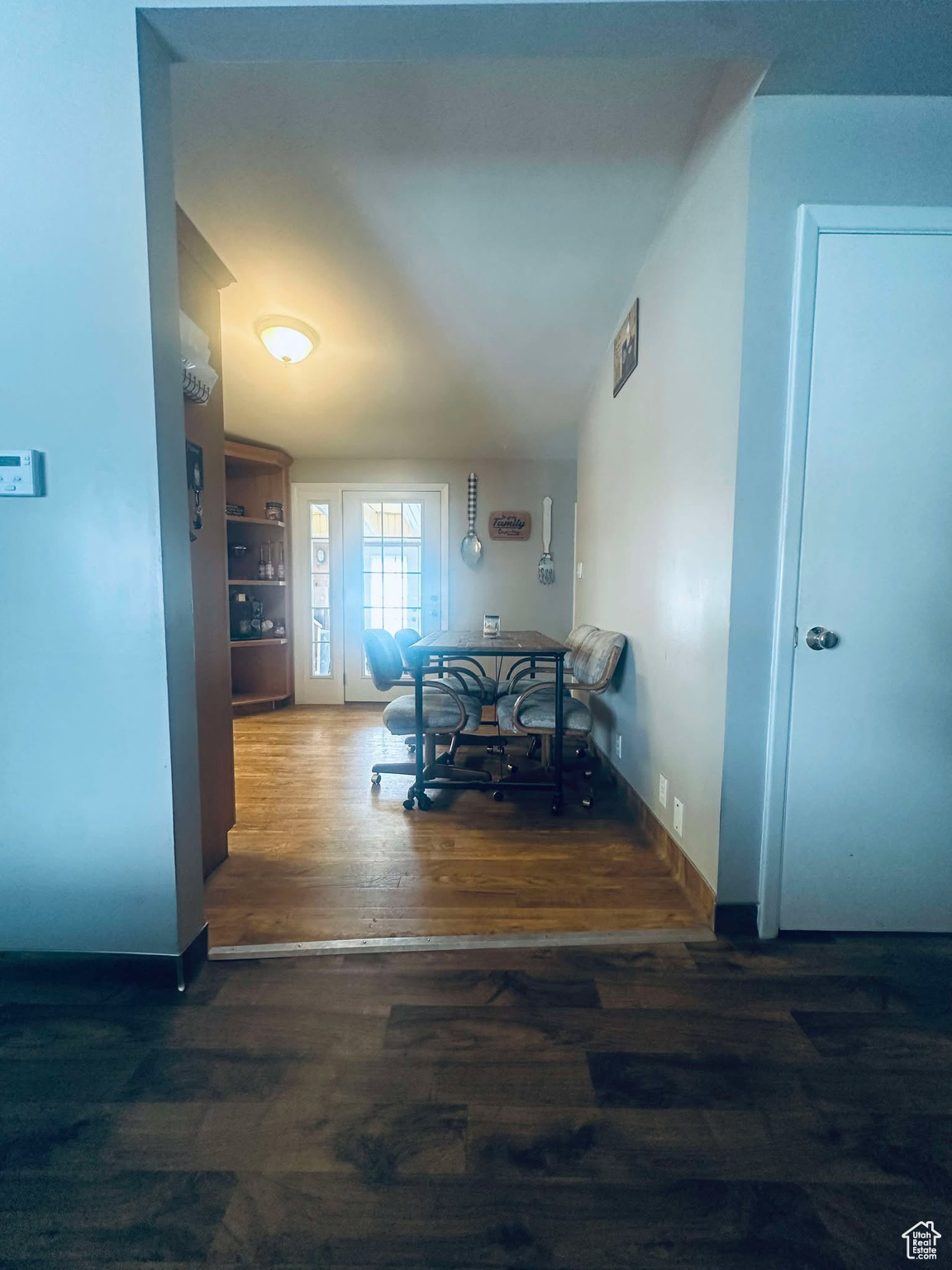 Dining space featuring dark wood-type flooring