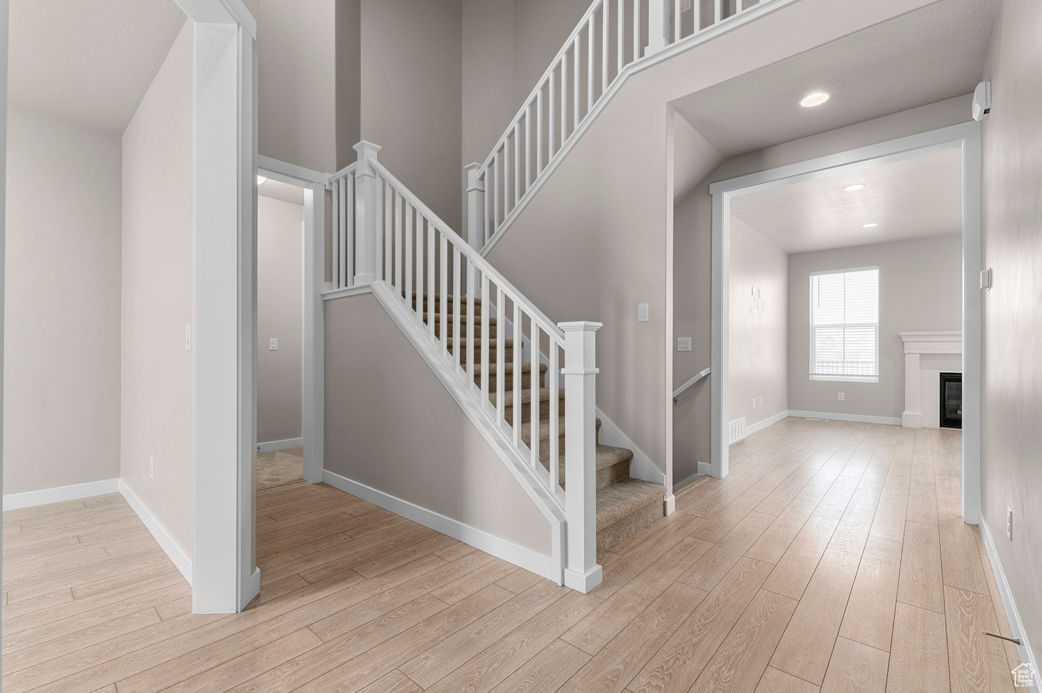 Stairs featuring hardwood / wood-style floors