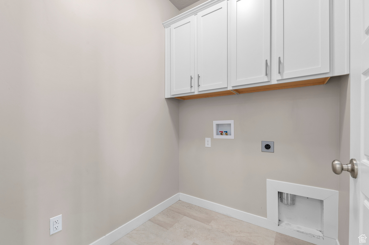 Laundry room with washer hookup, hookup for an electric dryer, and cabinets