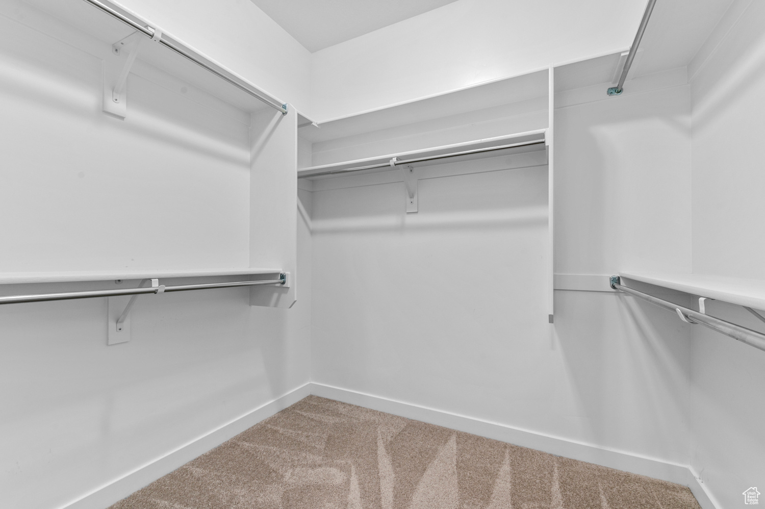 Spacious closet with carpet flooring