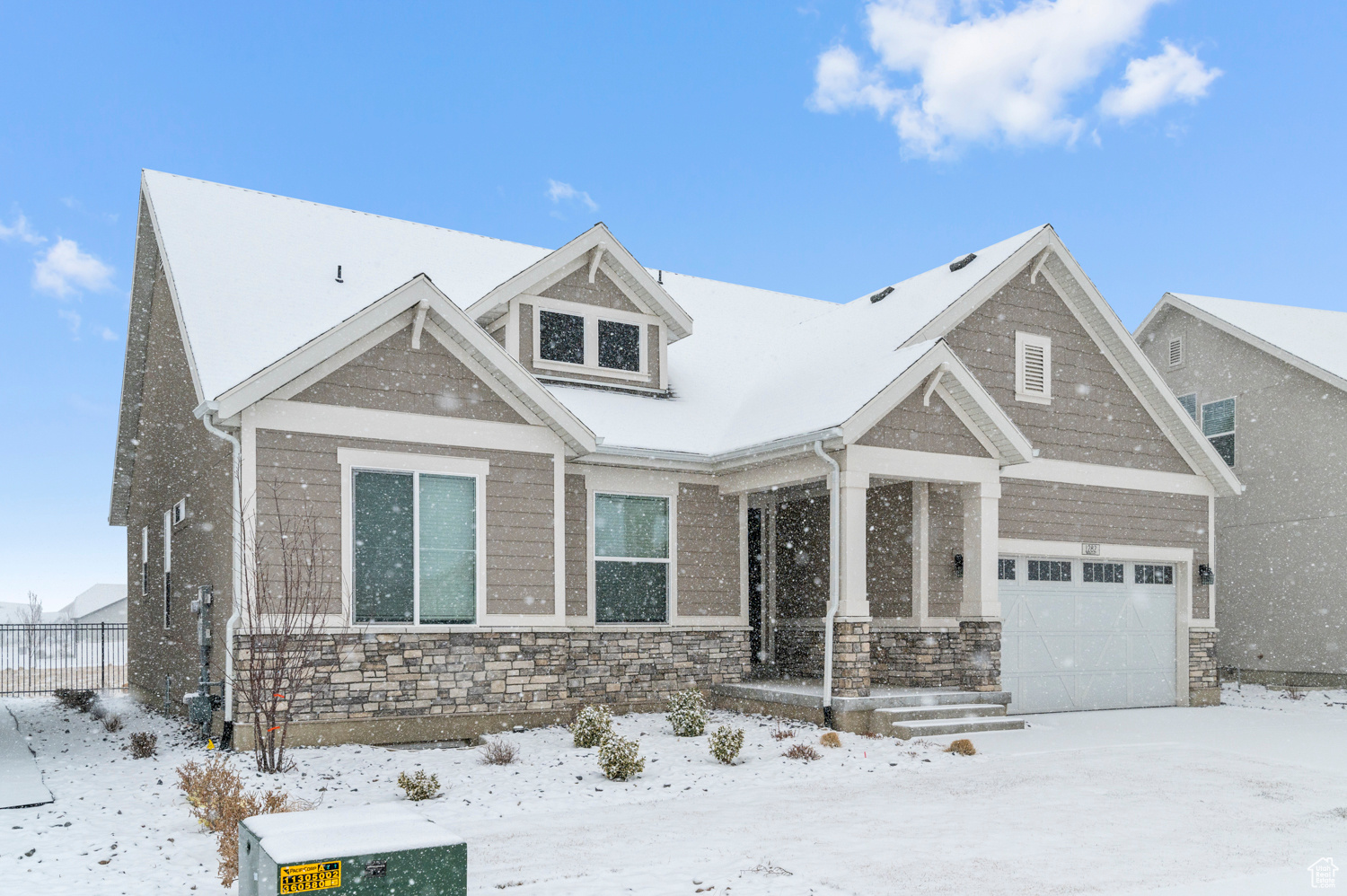Craftsman-style house featuring a garage