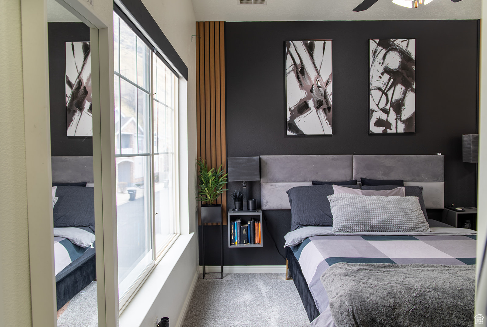 Bedroom featuring ceiling fan and carpet floors