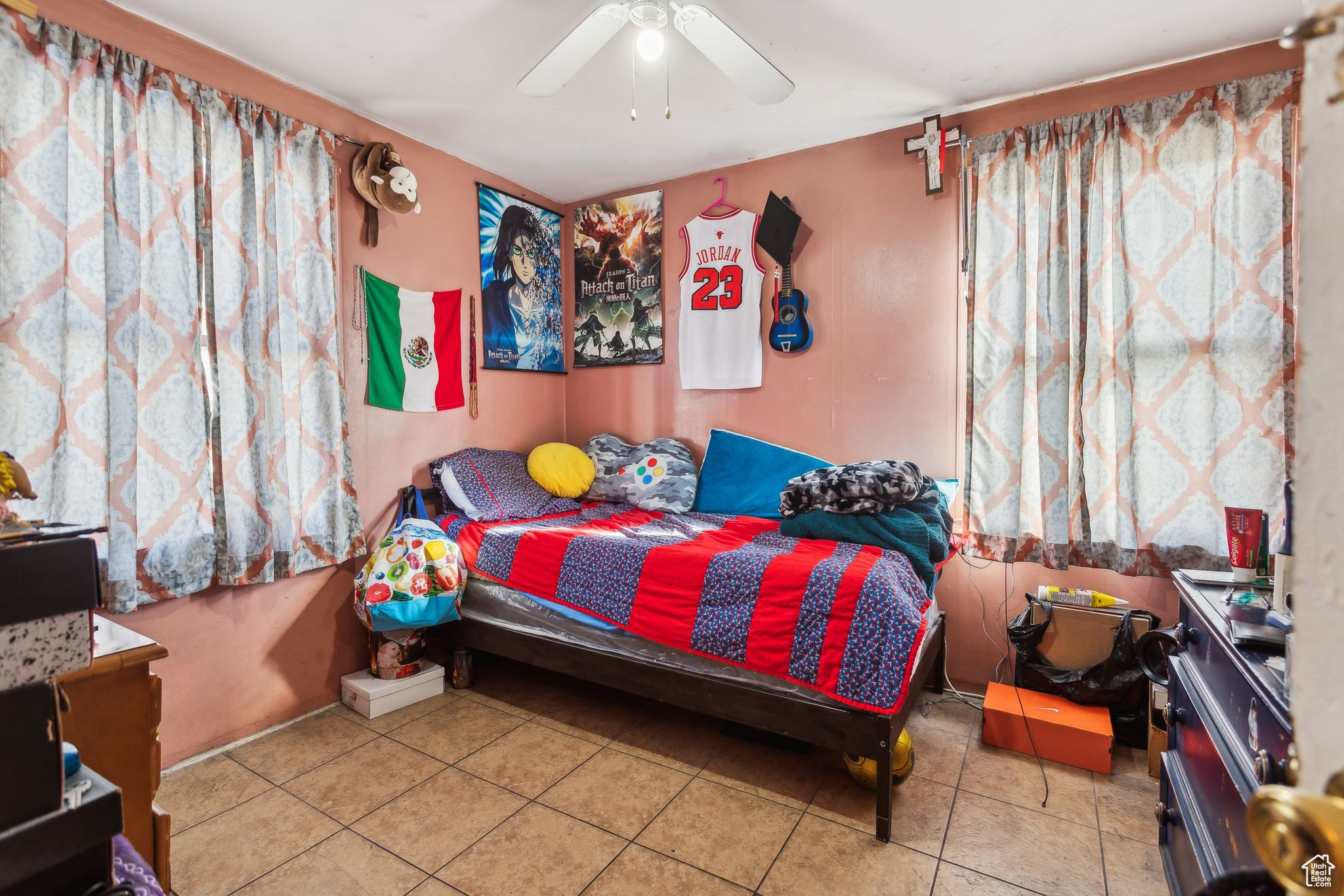 Bedroom featuring tile patterned flooring and ceiling fan