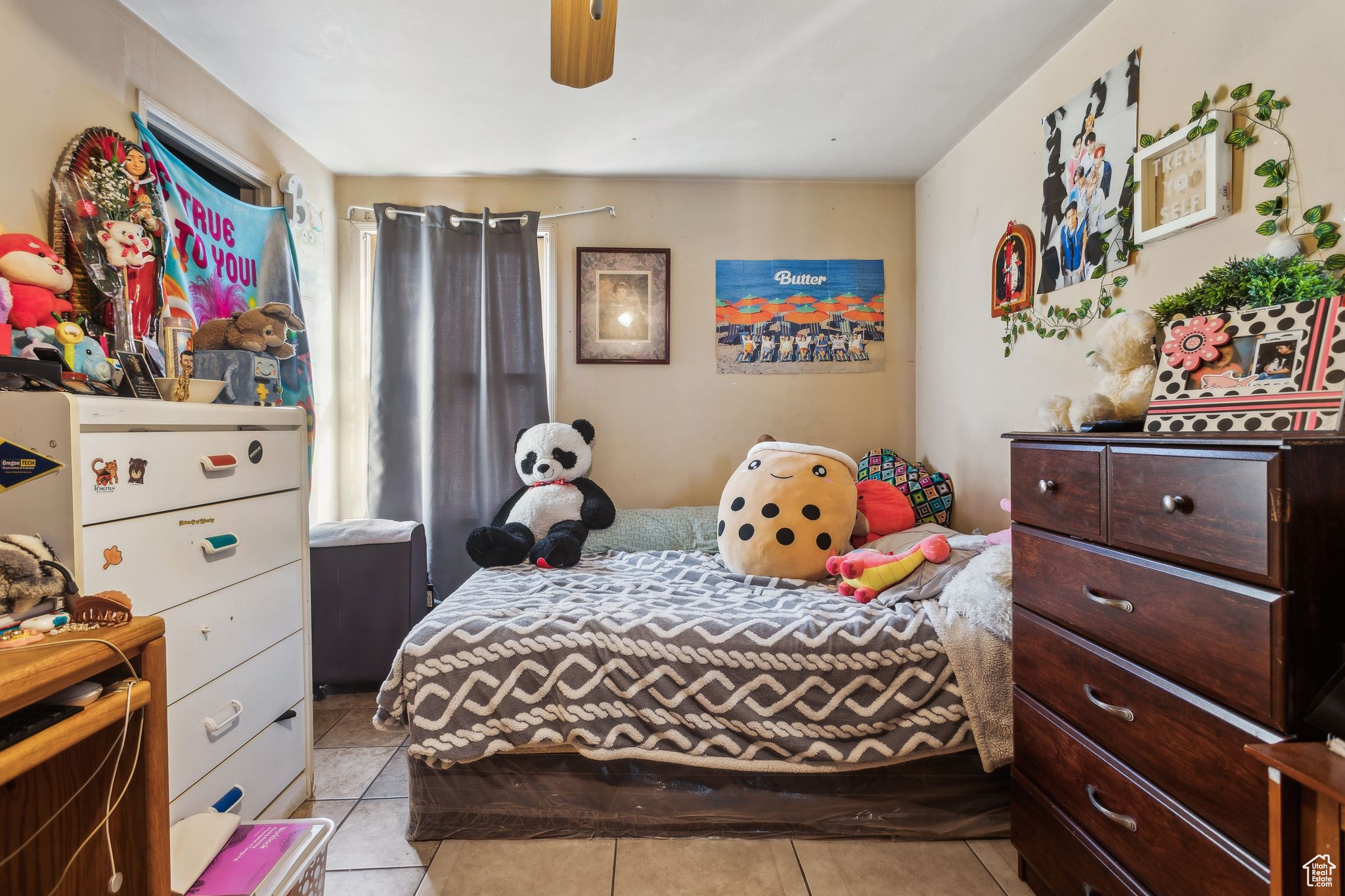 Tiled bedroom with ceiling fan