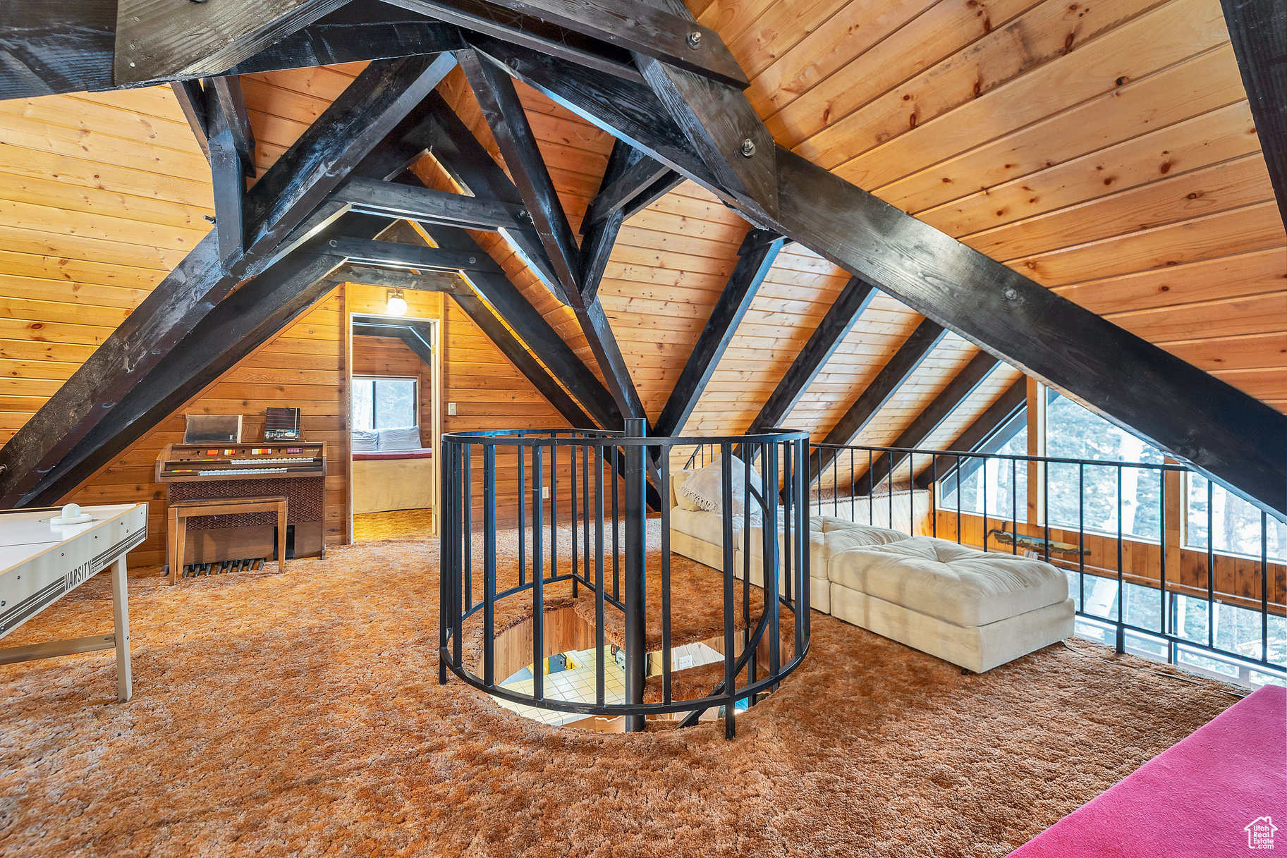 Bonus room with wood ceiling, carpet flooring, vaulted ceiling with beams, and wood walls