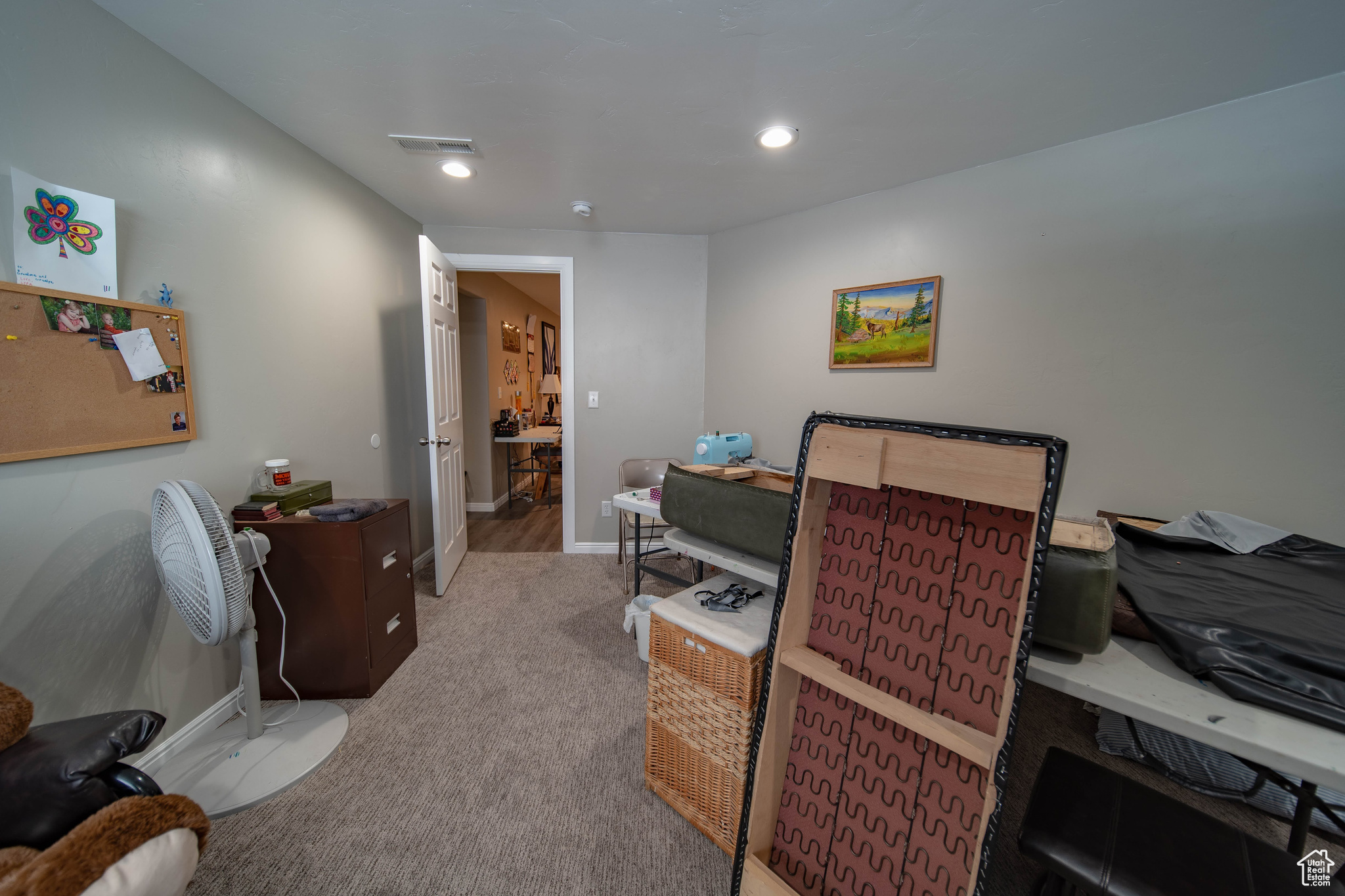 Bedroom with light colored carpet