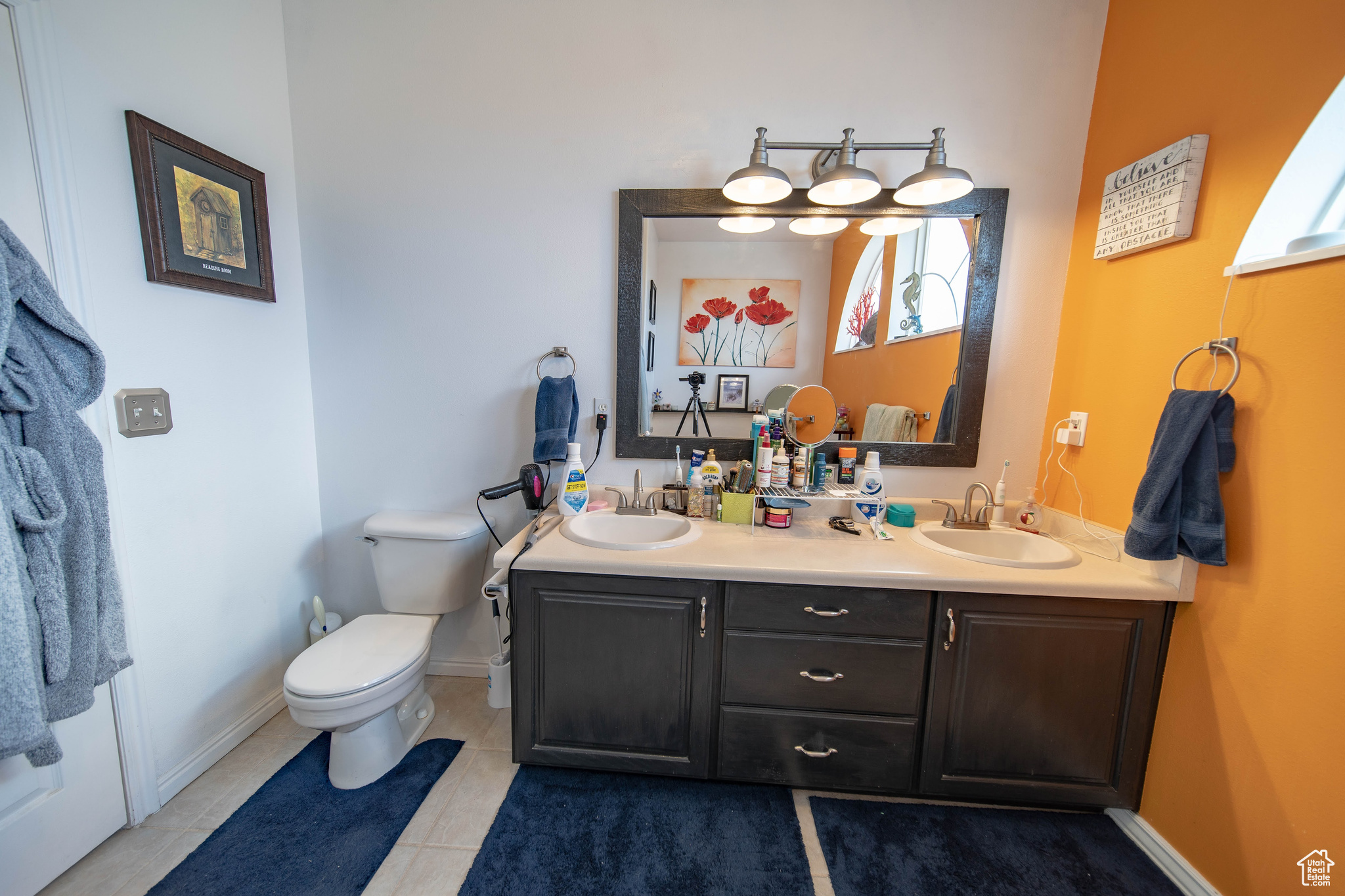 Bathroom featuring vanity, toilet, and tile patterned floors