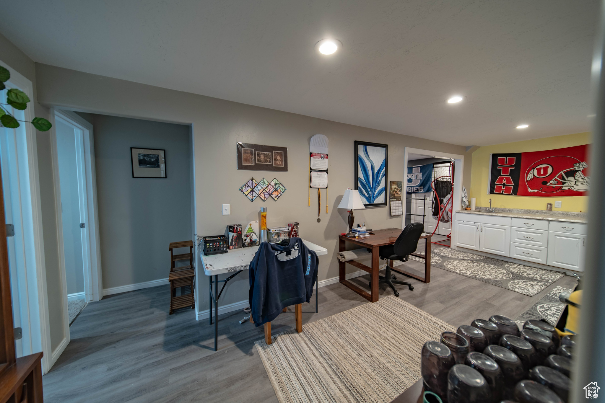 Dining area with light hardwood / wood-style floors and sink