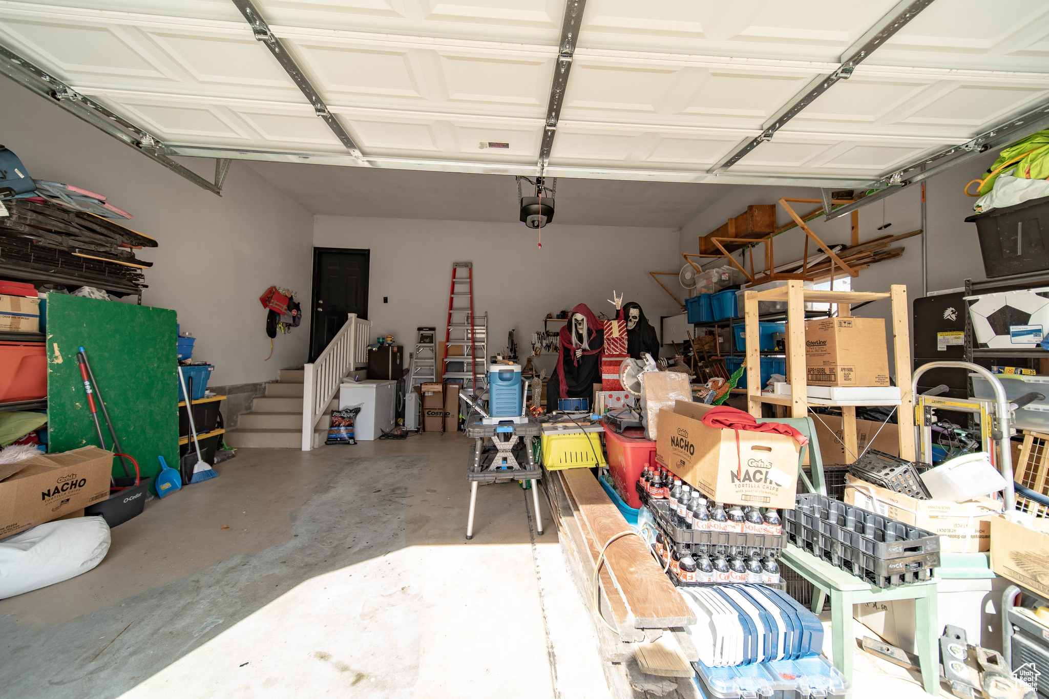 Garage featuring a garage door opener