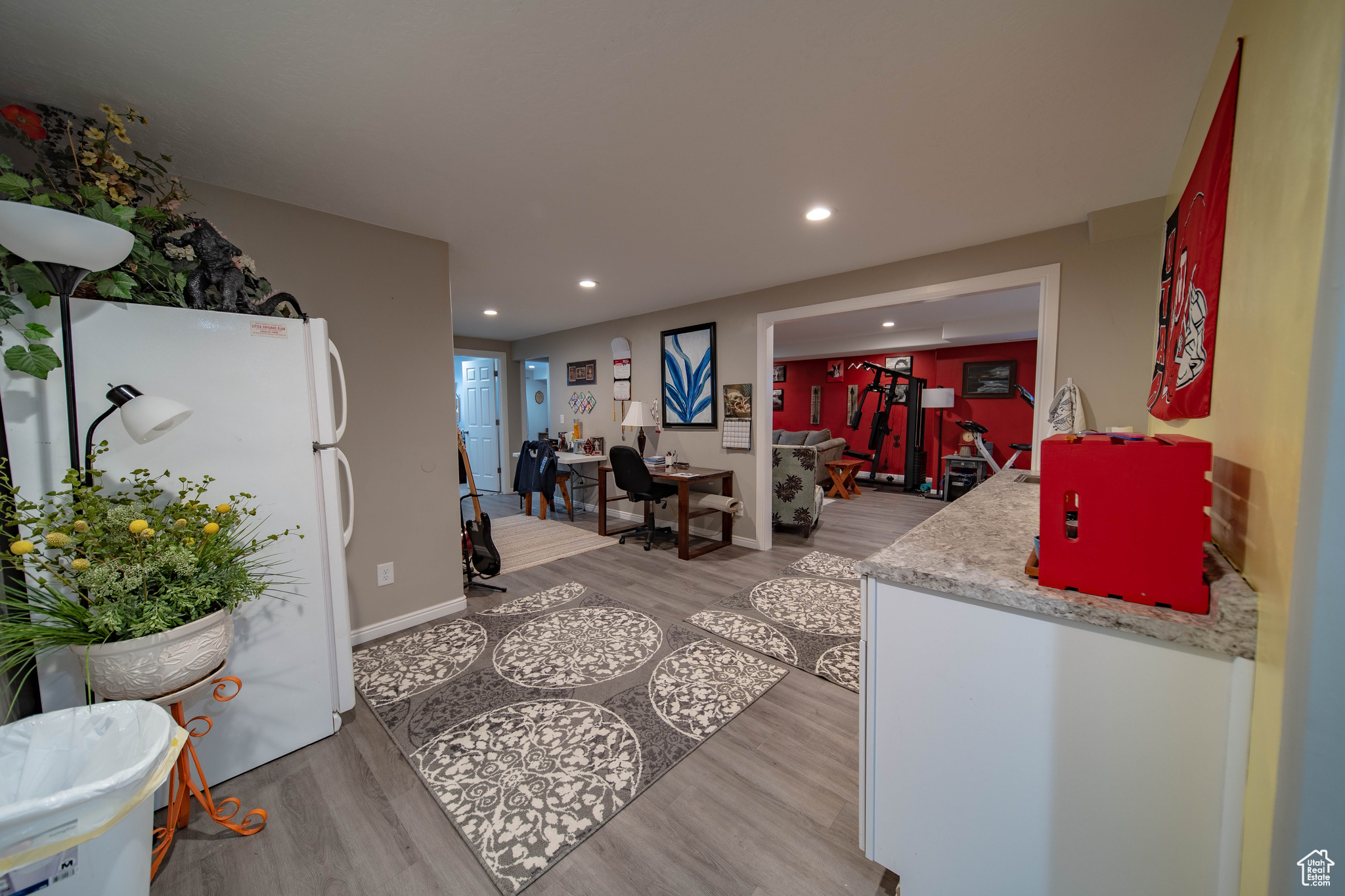 Kitchen featuring white fridge and light hardwood / wood-style floors