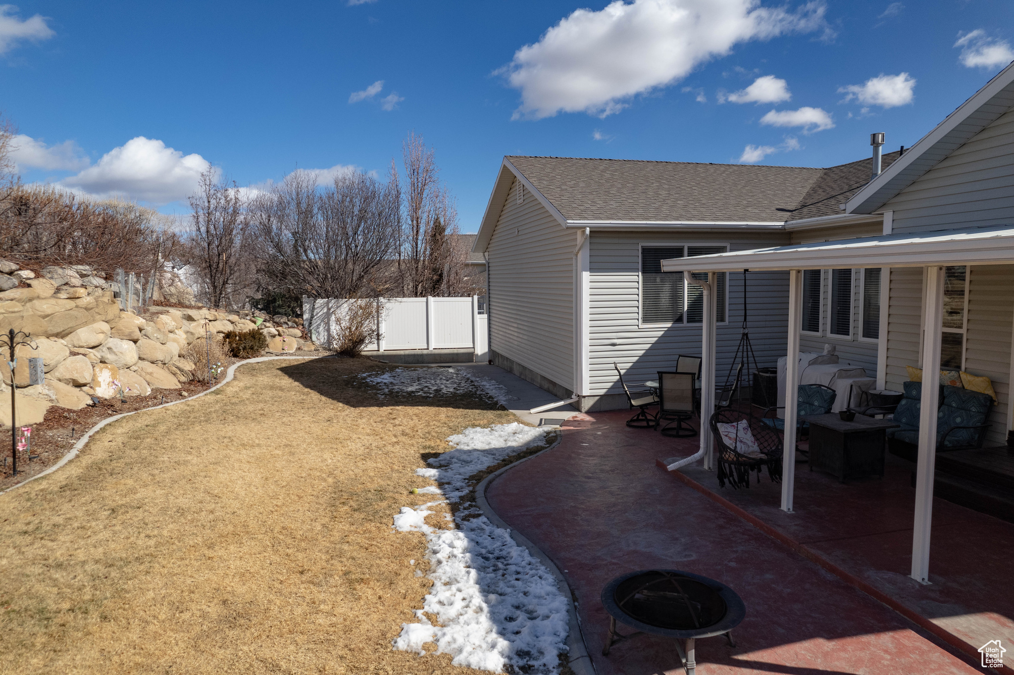 View of yard with a patio area and an outdoor fire pit