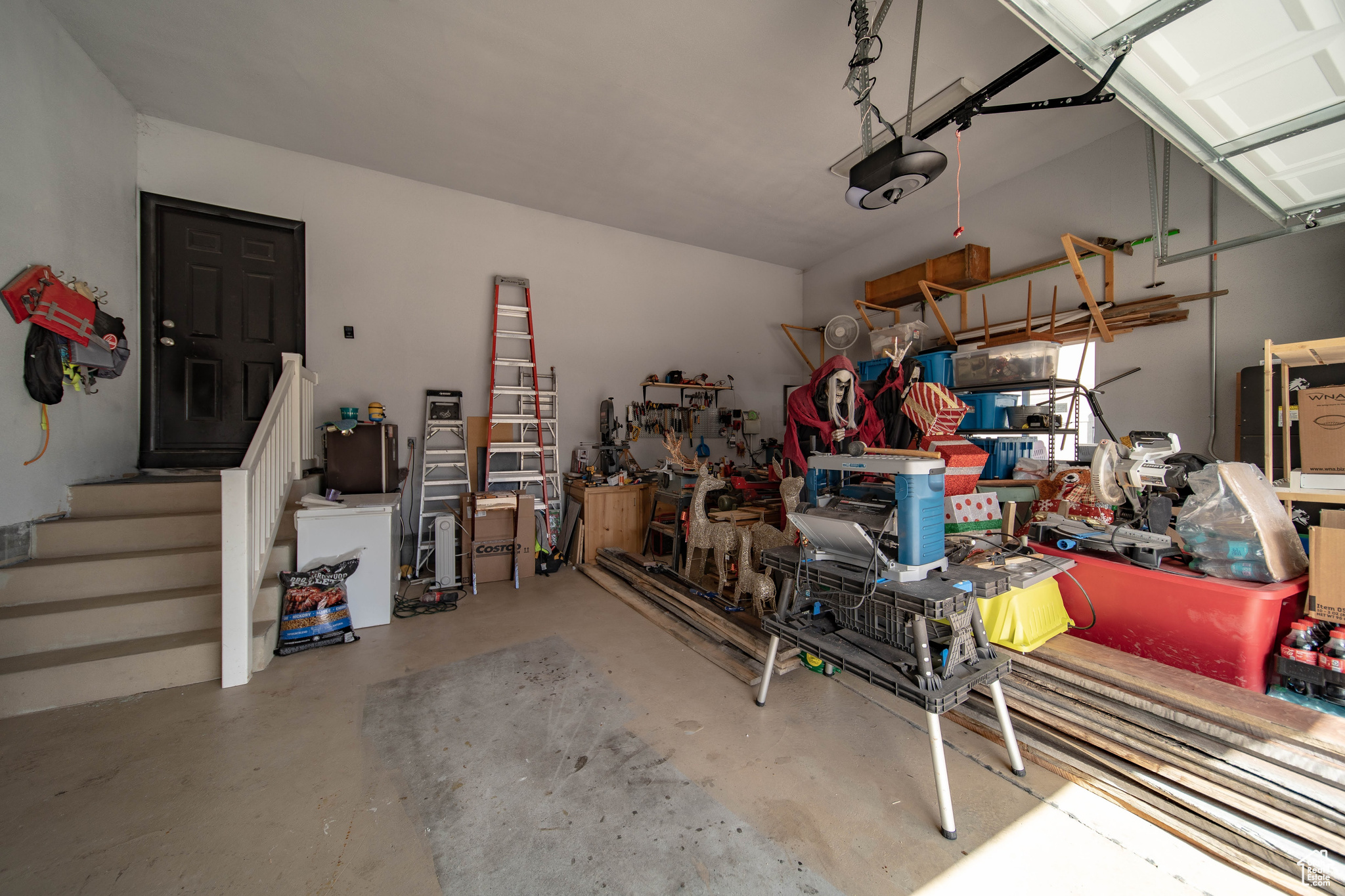 Garage featuring a garage door opener