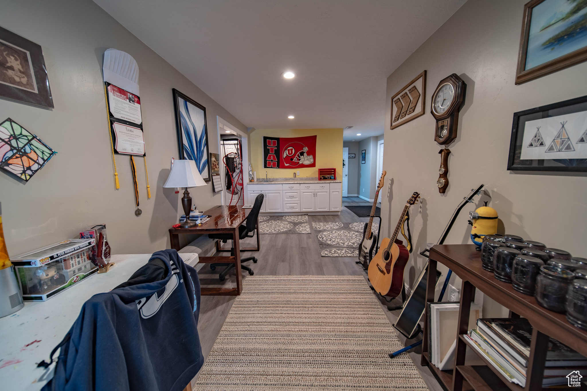 Home office with light hardwood / wood-style flooring