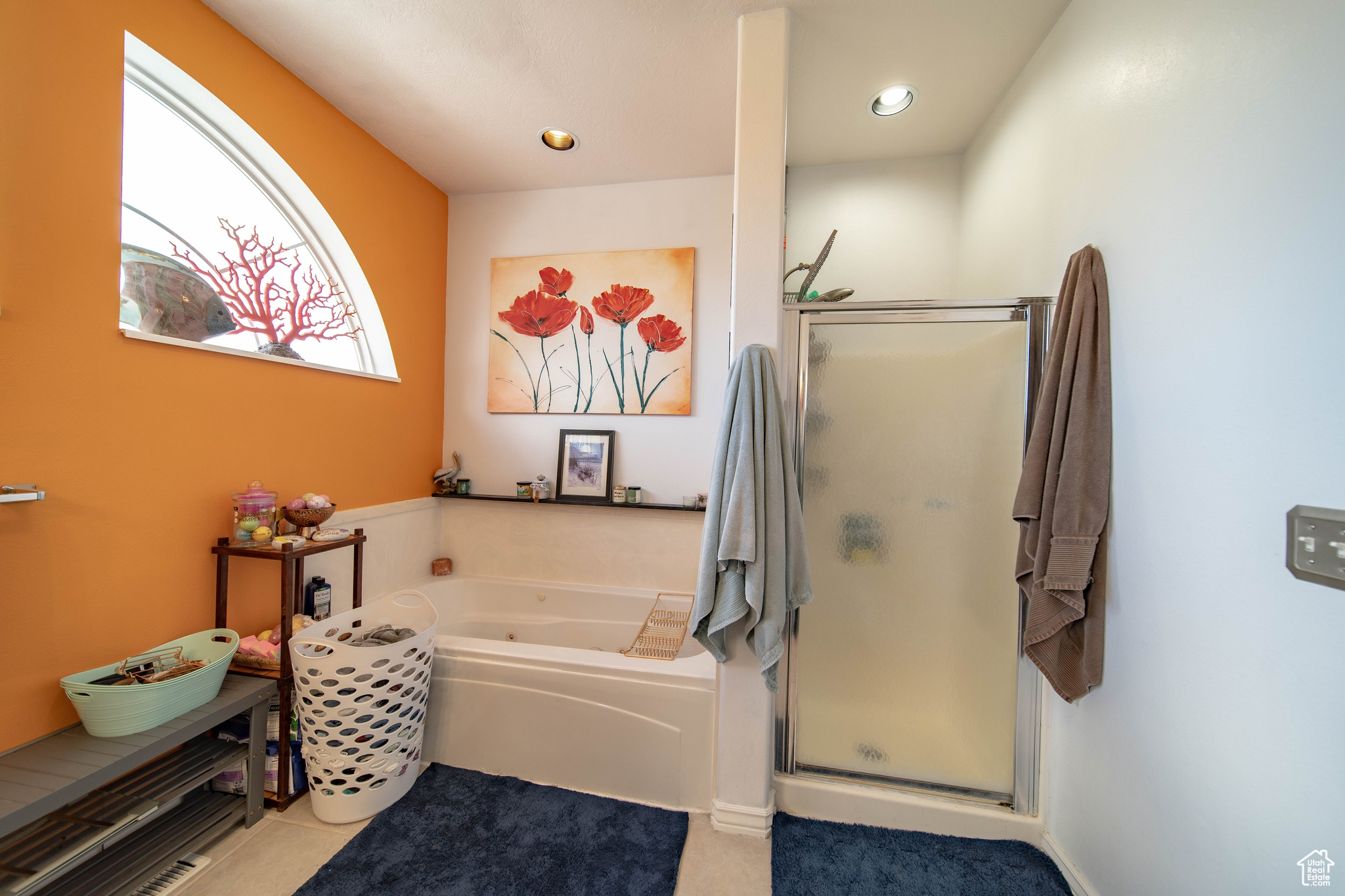 Bathroom with tile patterned floors and plus walk in shower