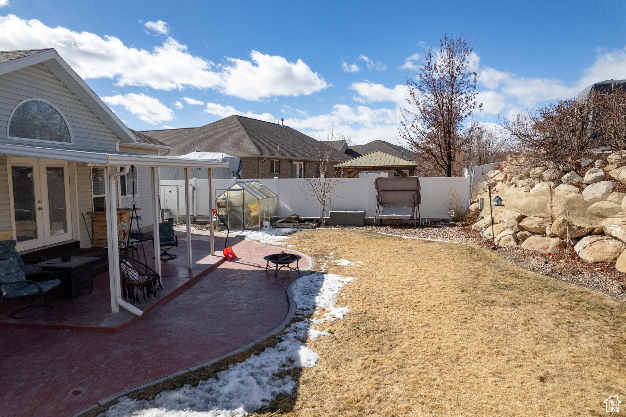 View of yard featuring french doors, a patio, and an outdoor structure