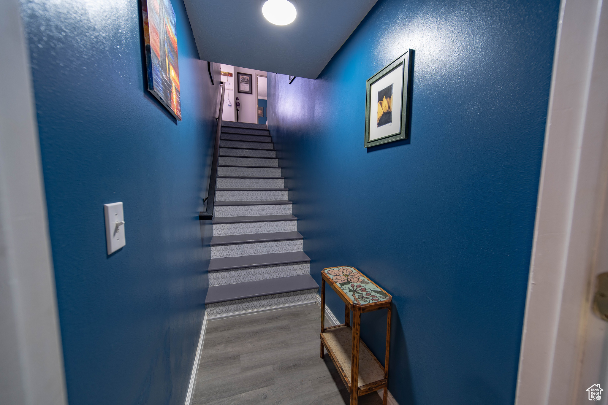 Stairs with hardwood / wood-style flooring