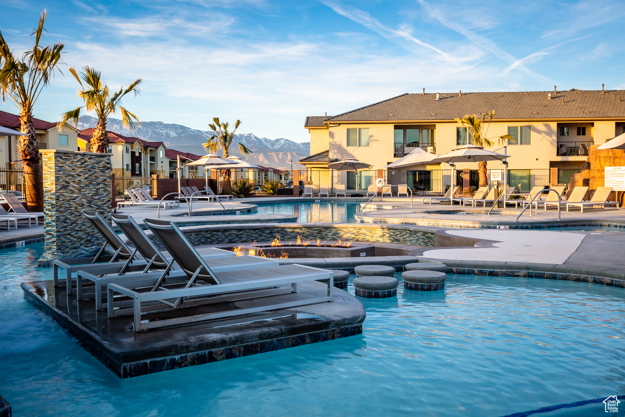 View of pool featuring a mountain view, a jacuzzi, and a patio area