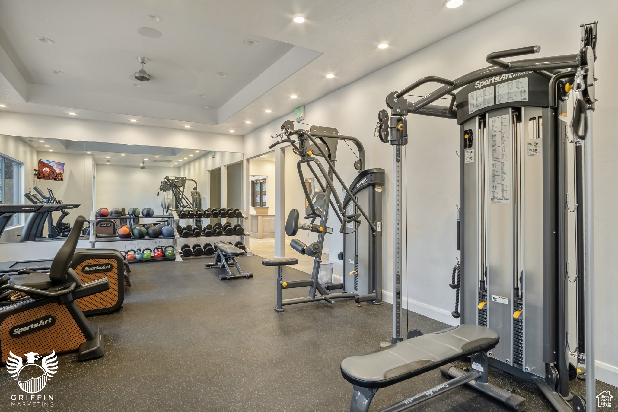 Exercise room featuring a raised ceiling