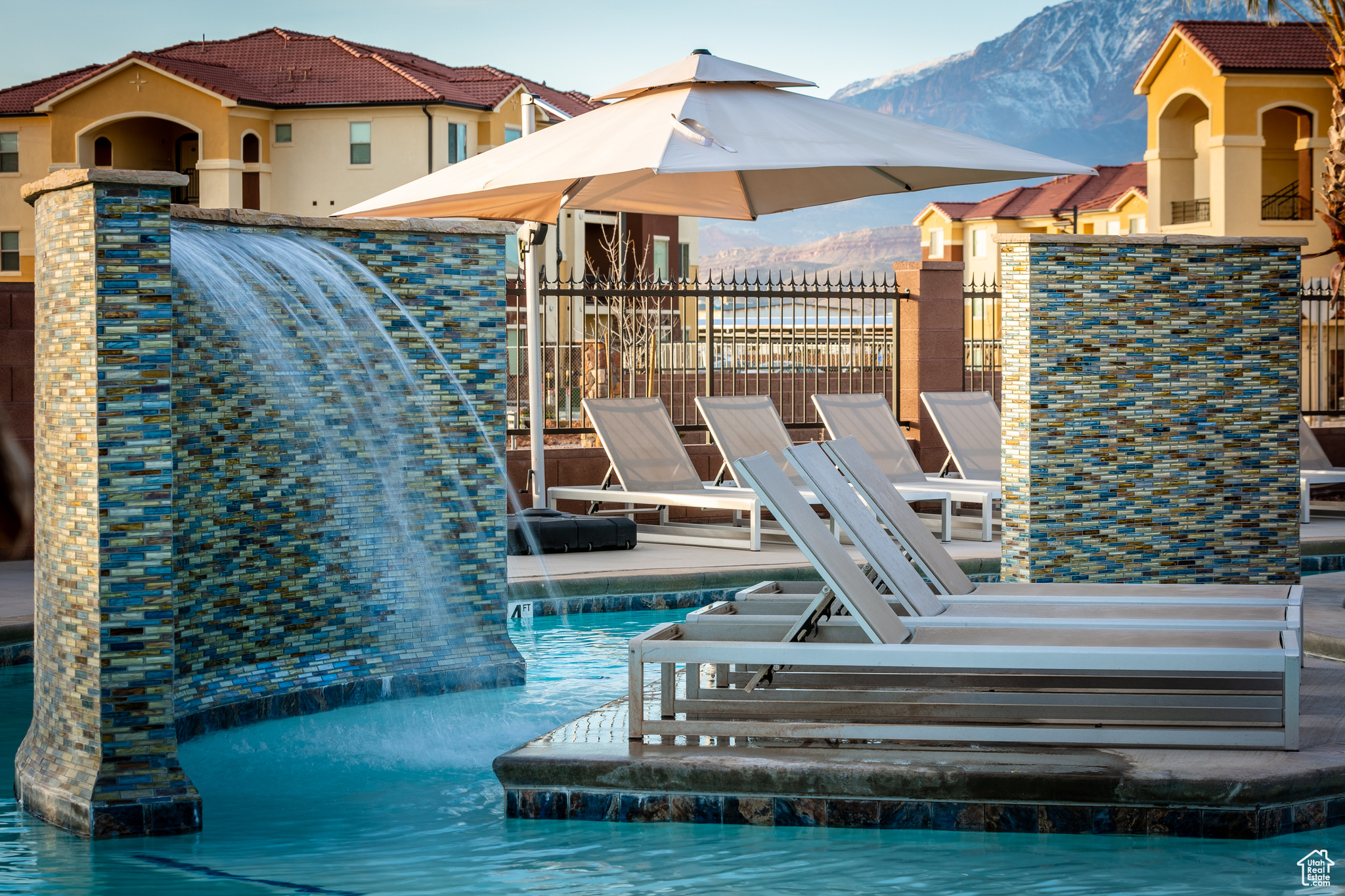 Exterior space with a mountain view and pool water feature