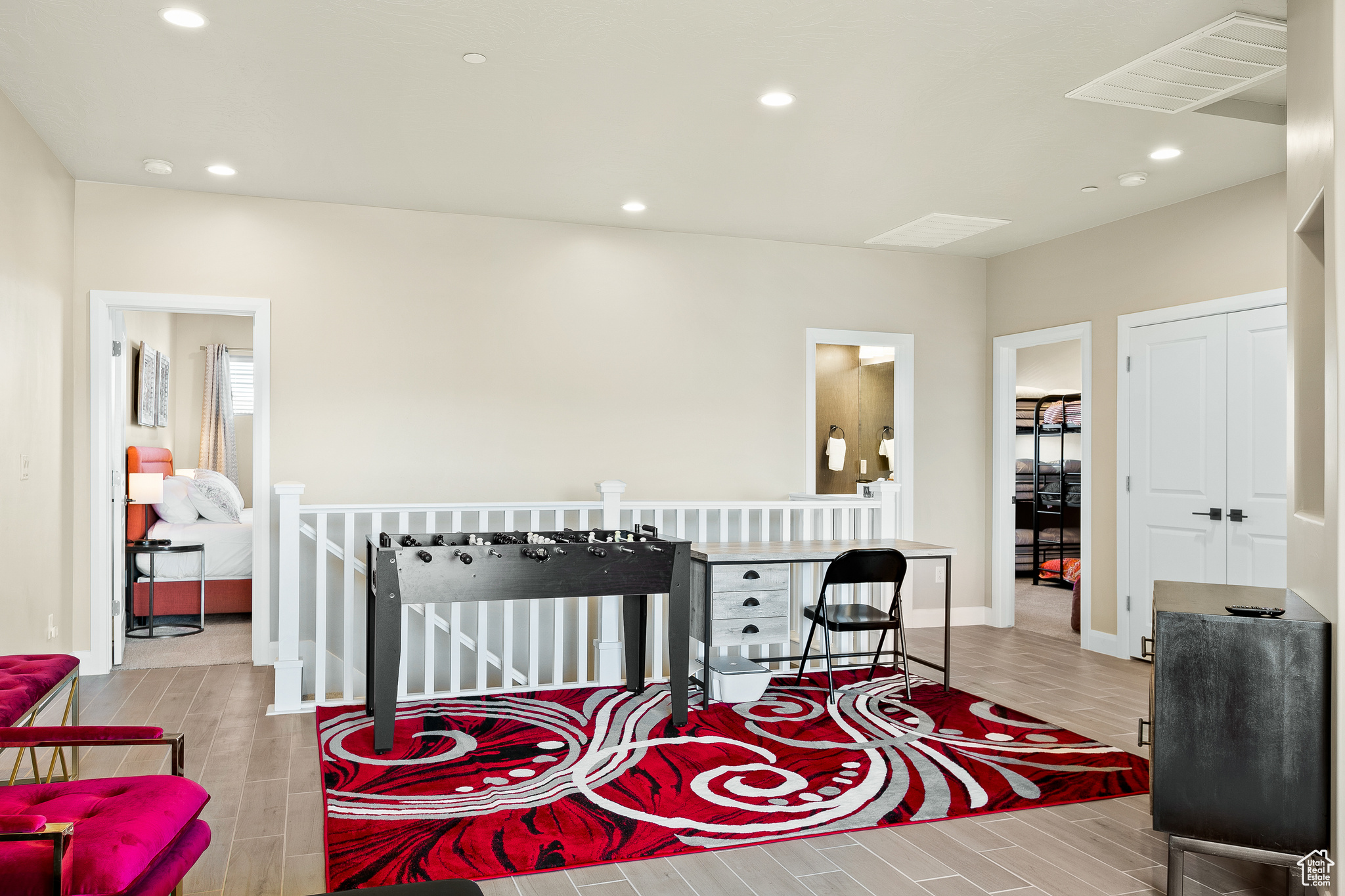 Sitting room with light hardwood / wood-style floors