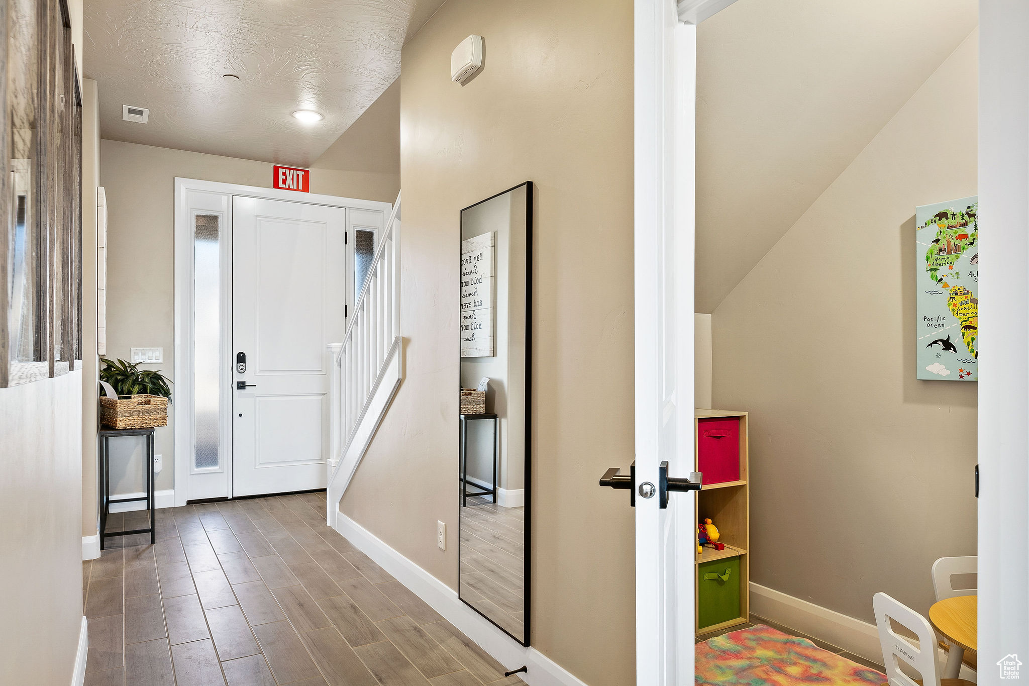Entrance foyer with hardwood / wood-style floors