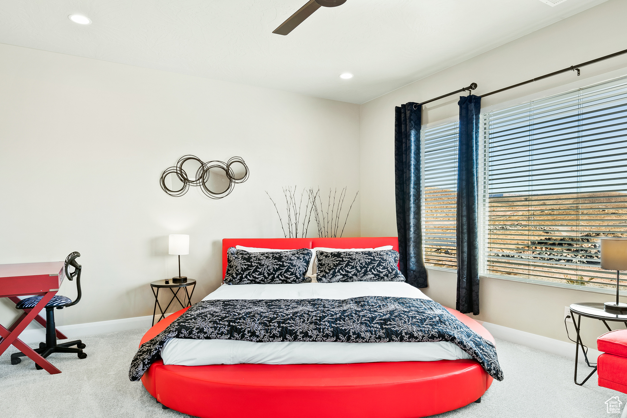 Bedroom with ceiling fan and carpet flooring