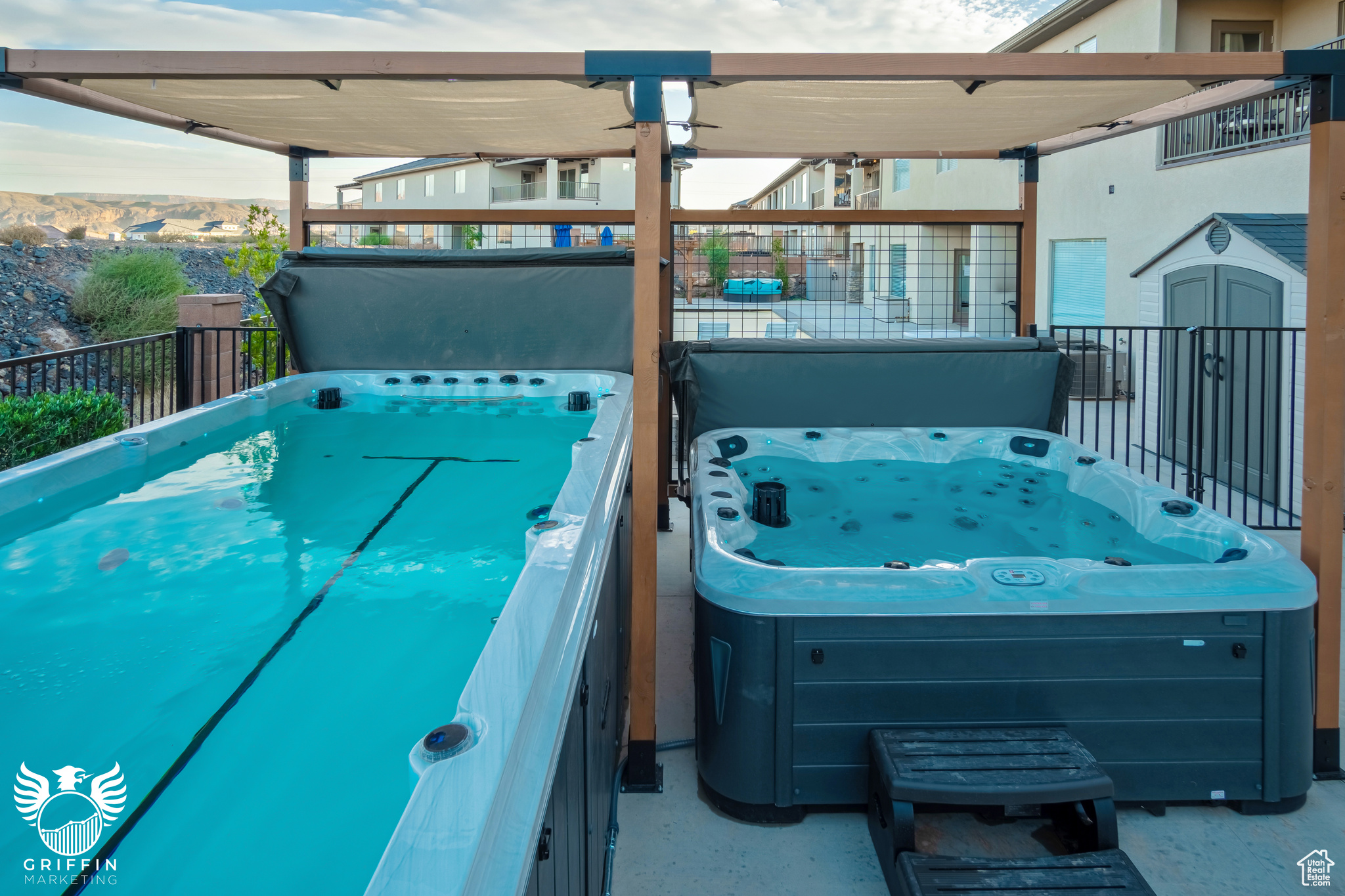 Exterior space with a mountain view and a covered hot tub