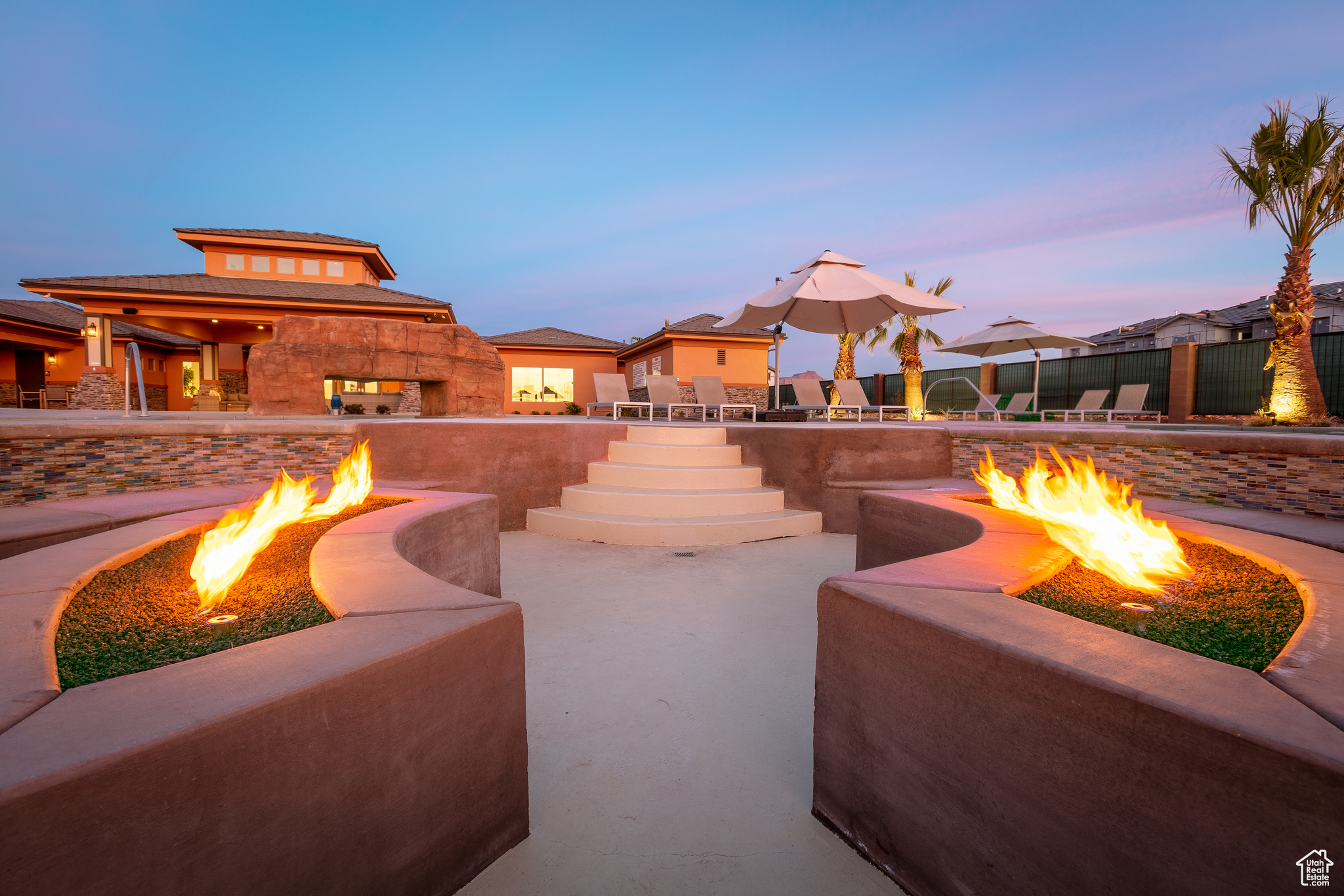 Patio terrace at dusk with a fire pit