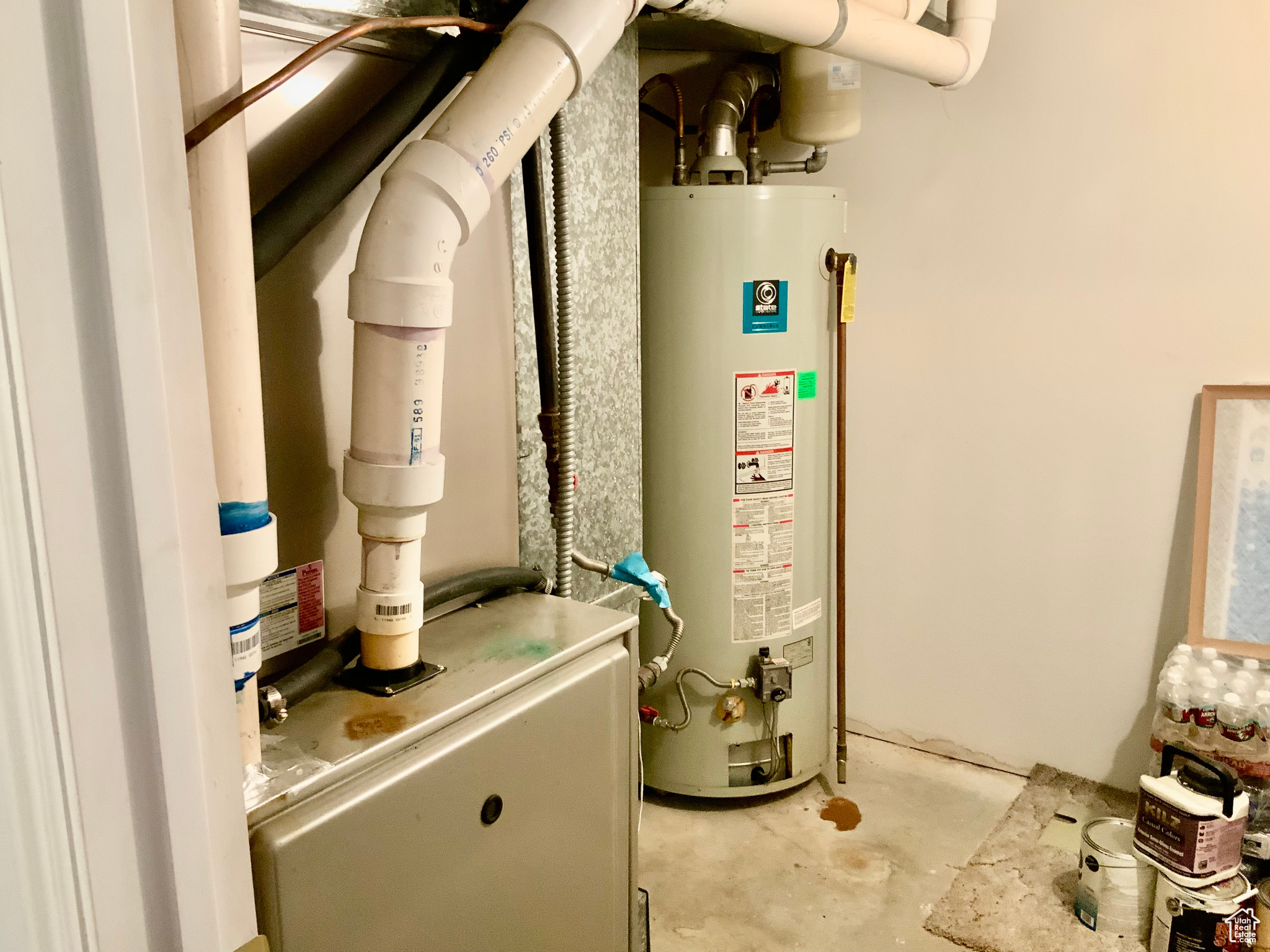 Utility room featuring water heater