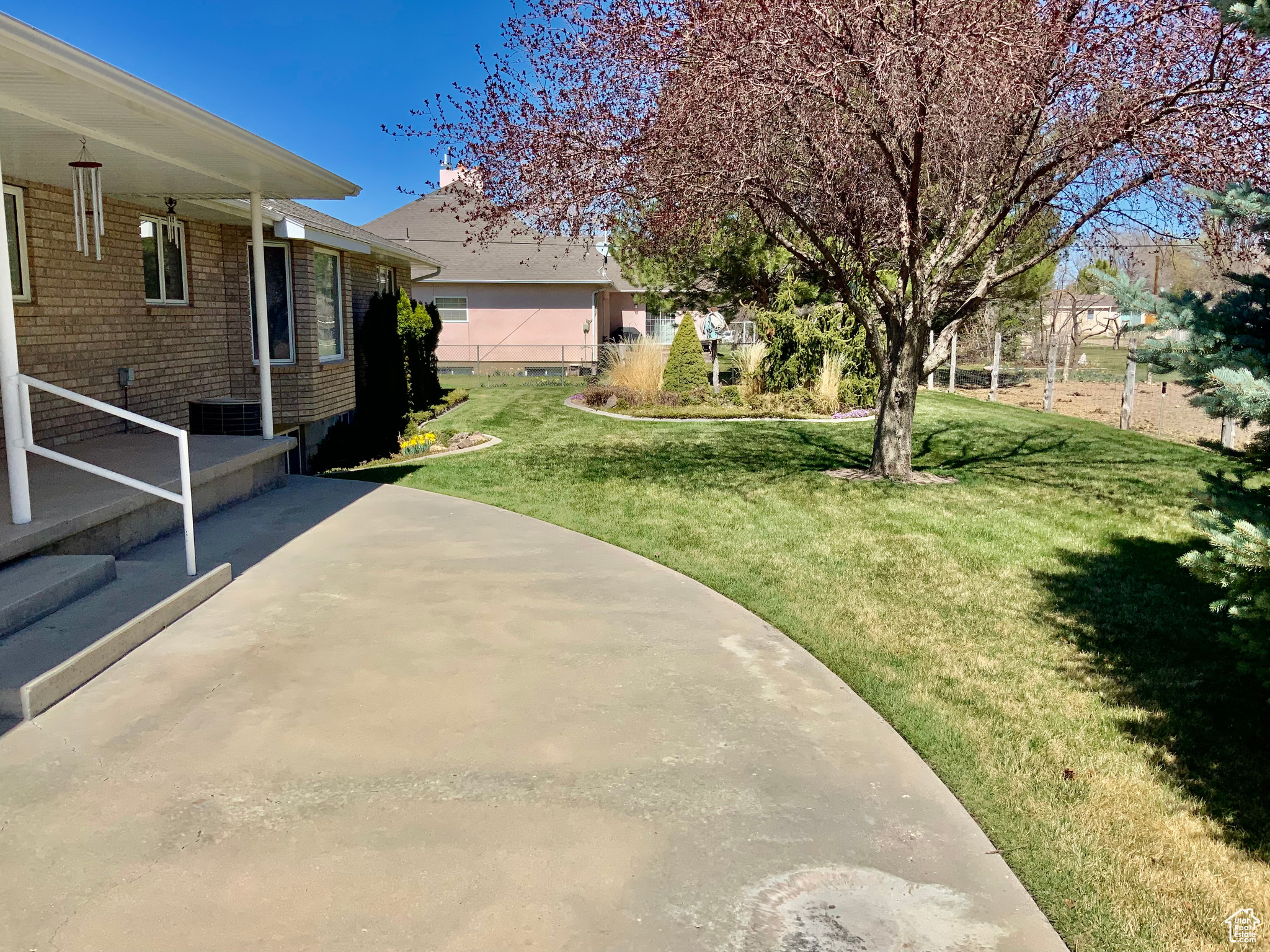 View of yard with a patio and central AC unit