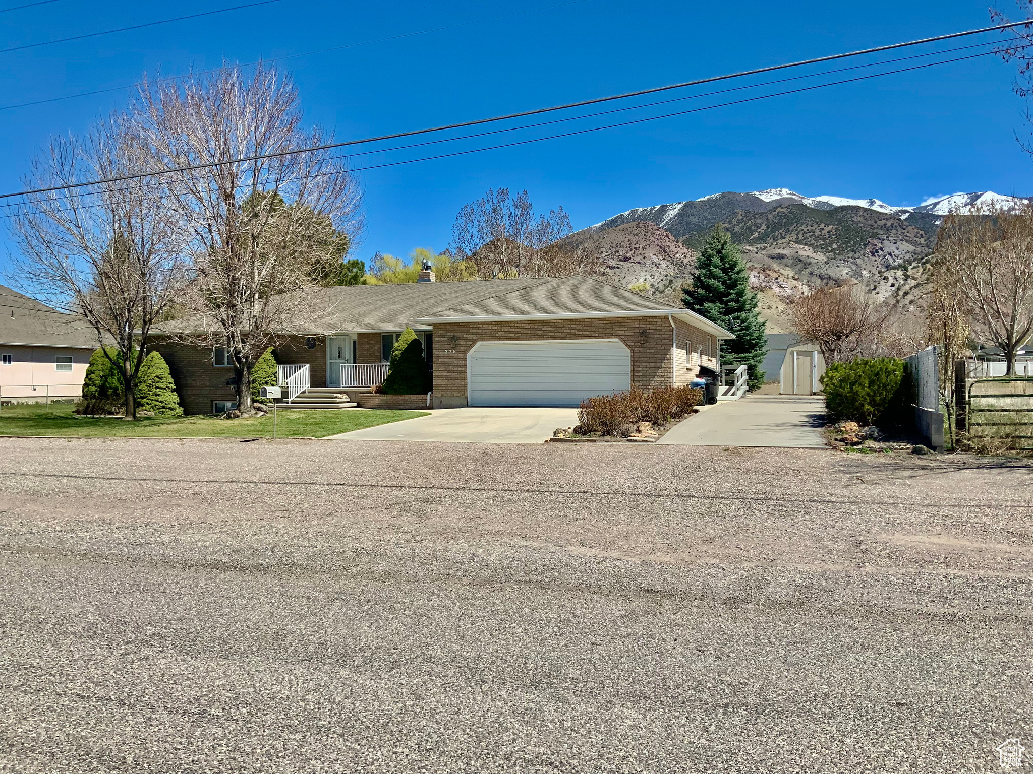 Ranch-style house featuring a mountain view and a garage