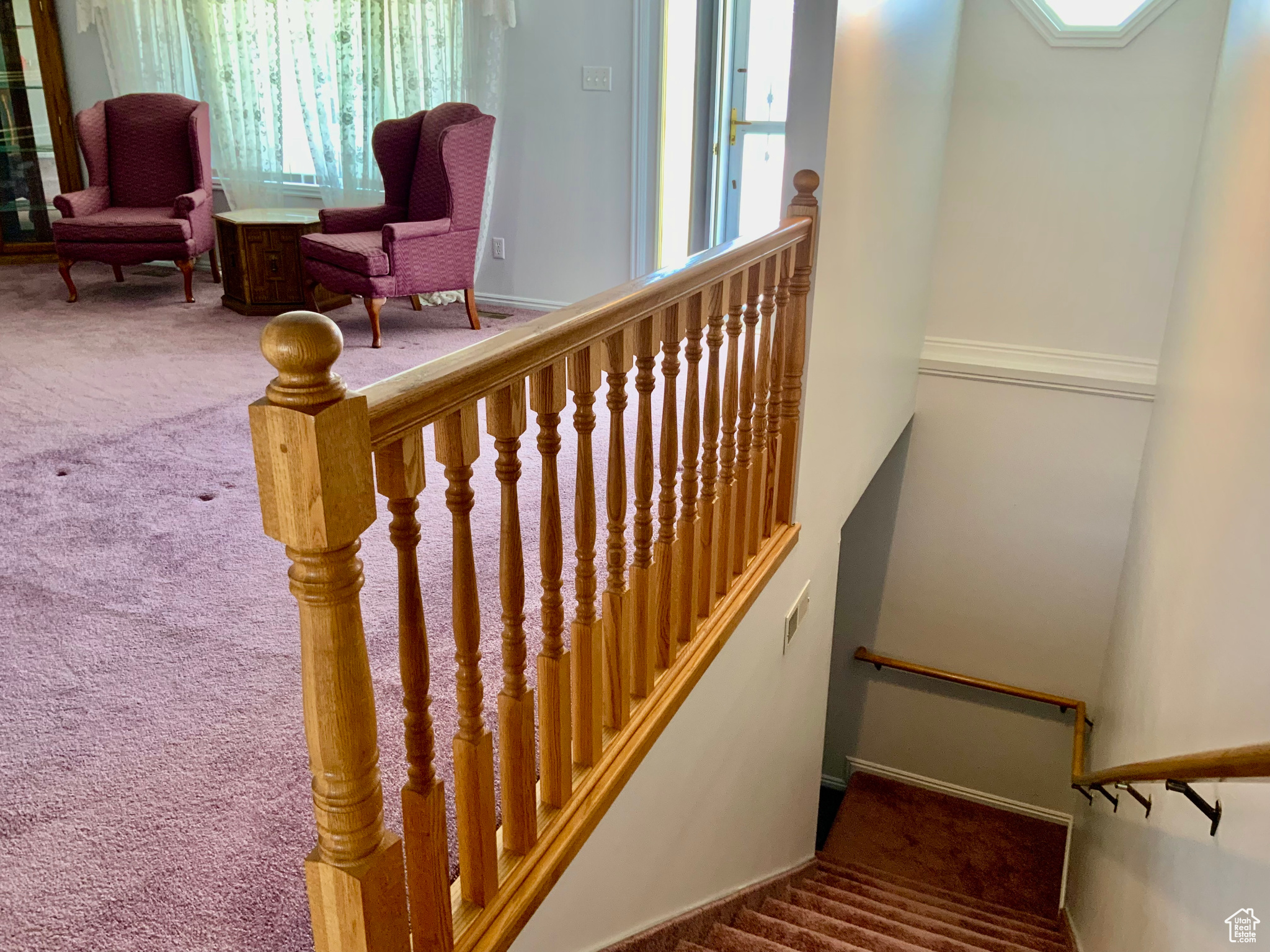 Stairs featuring carpet floors
