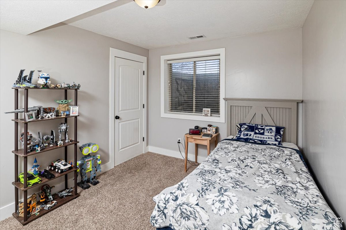 Bedroom featuring carpet