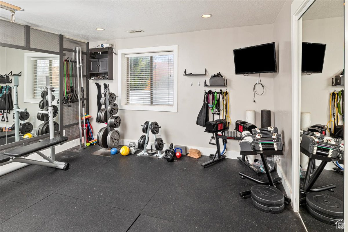 Gym with a textured ceiling