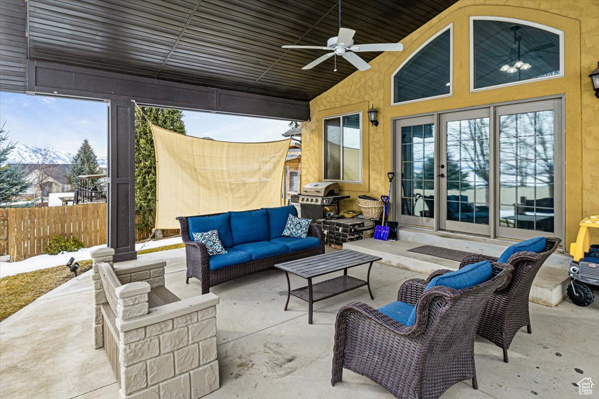 View of patio / terrace with a ceiling fan, outdoor lounge area, fence, and grilling area