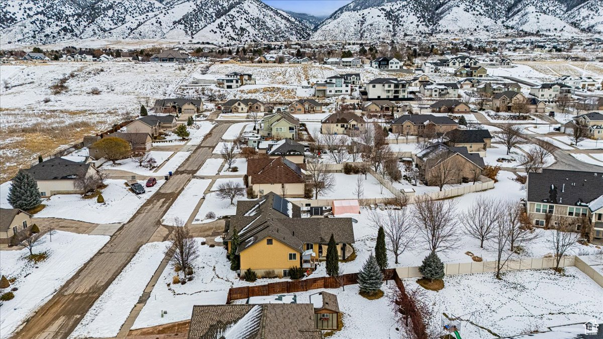 Snowy aerial view featuring a mountain view