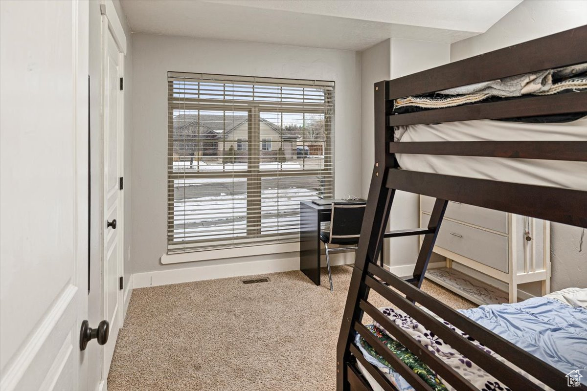 Bedroom with carpet flooring