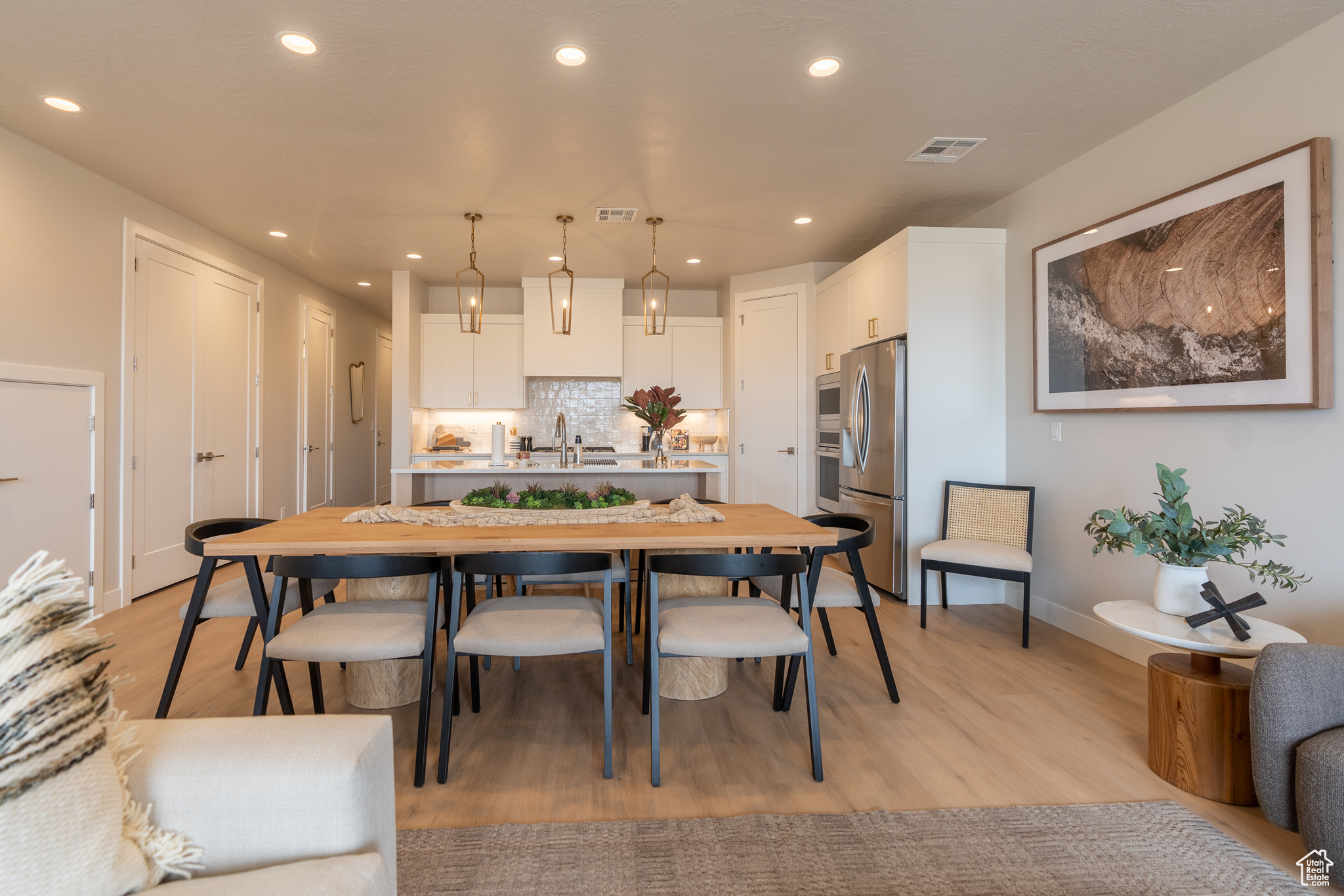 Dining area featuring sink and light hardwood / wood-style floors