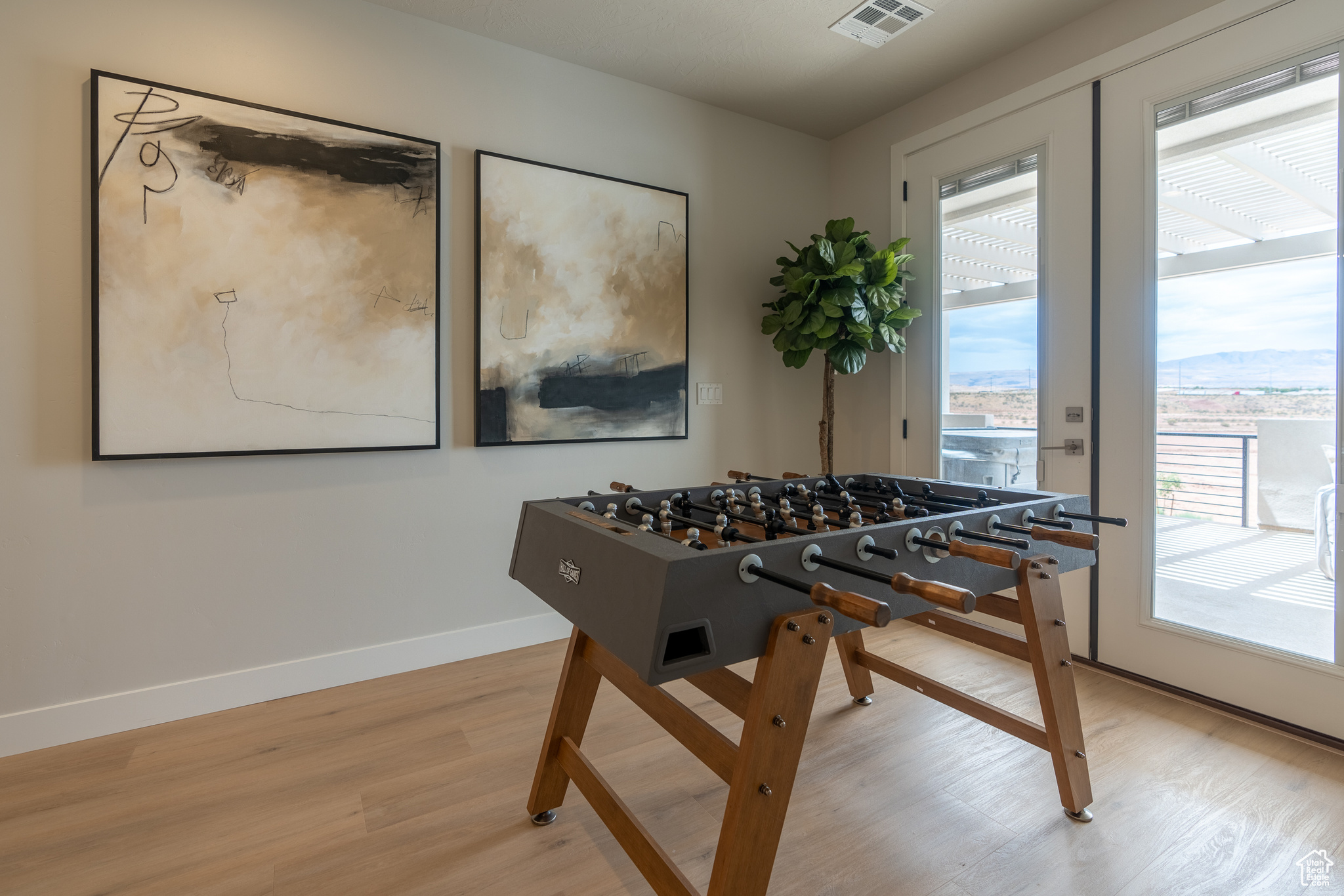 Playroom with wood-type flooring