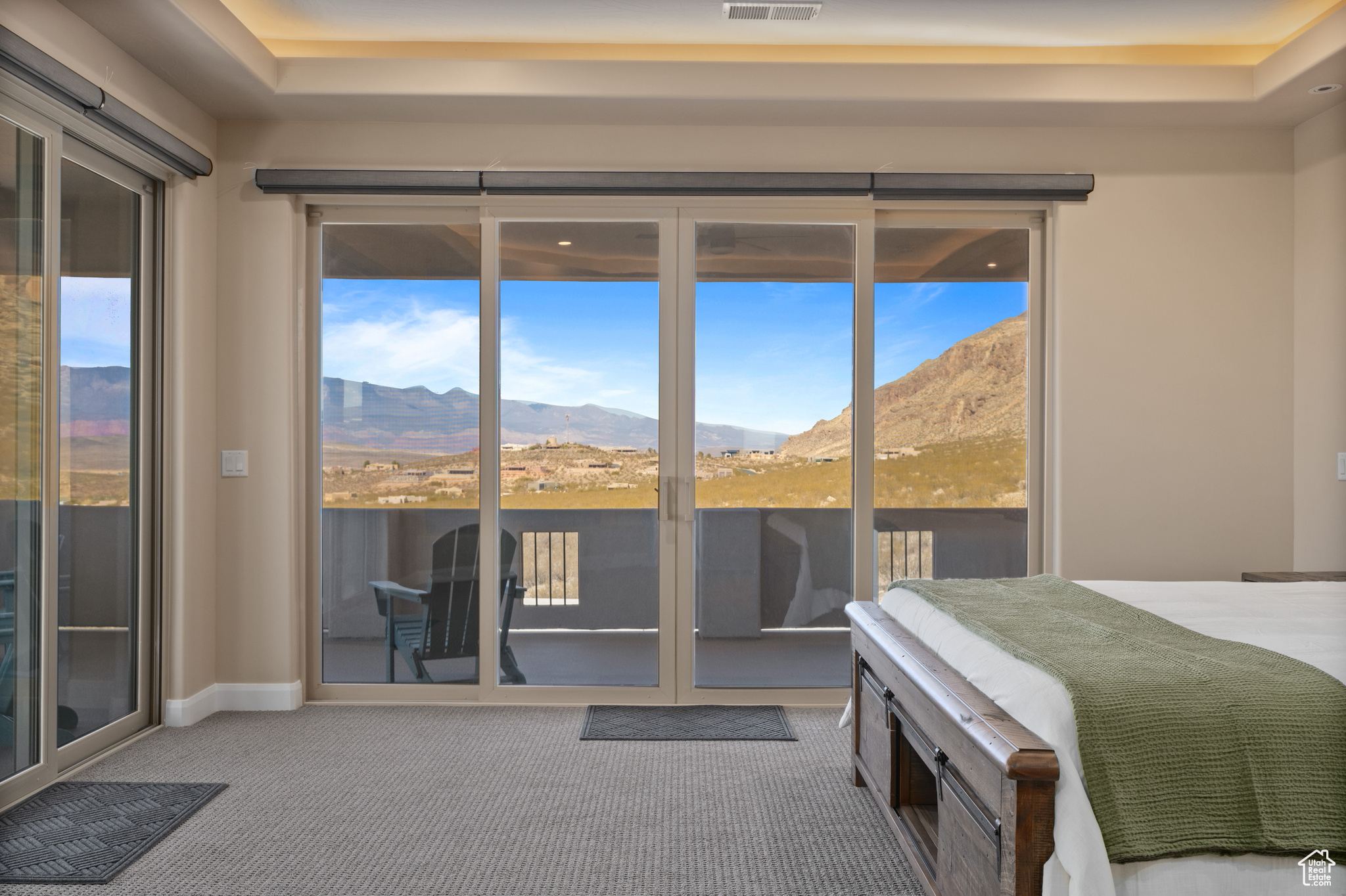 Bedroom featuring a mountain view, access to outside, and carpet flooring