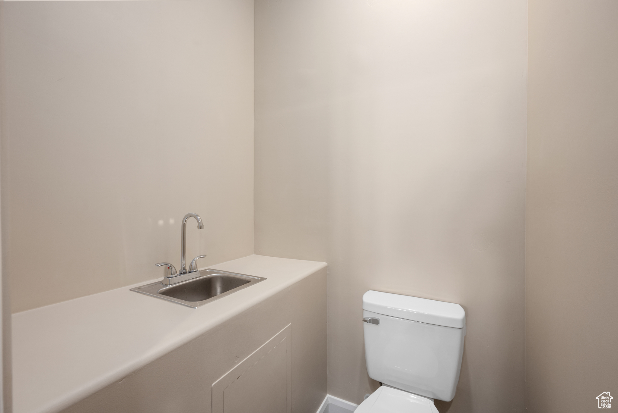 Bathroom featuring sink and toilet